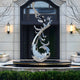 Contemporary phoenix sculpture placed in garden fountain setting.