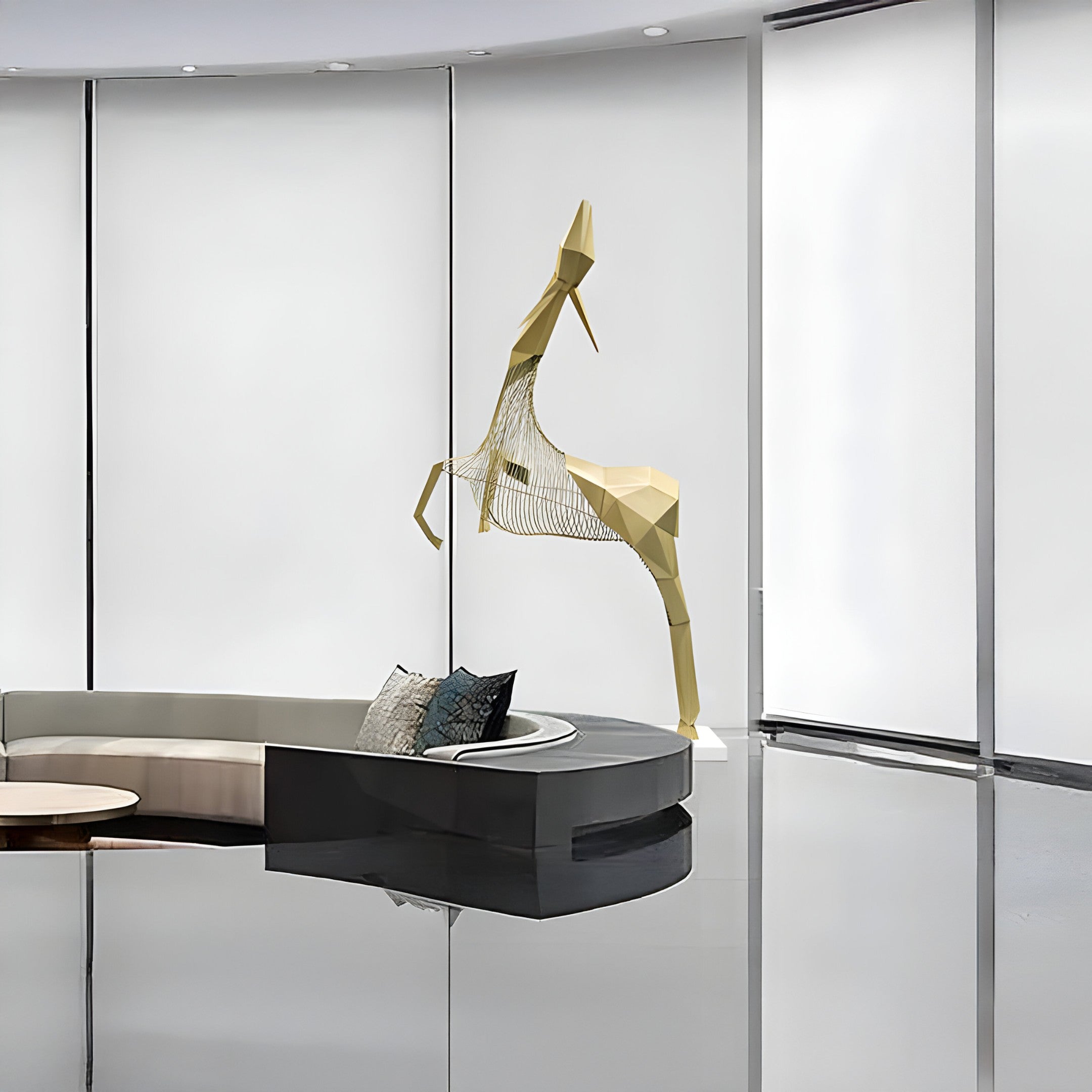 The sculpture in a modern, spacious room, featuring its intricate wire and solid golden shapes.