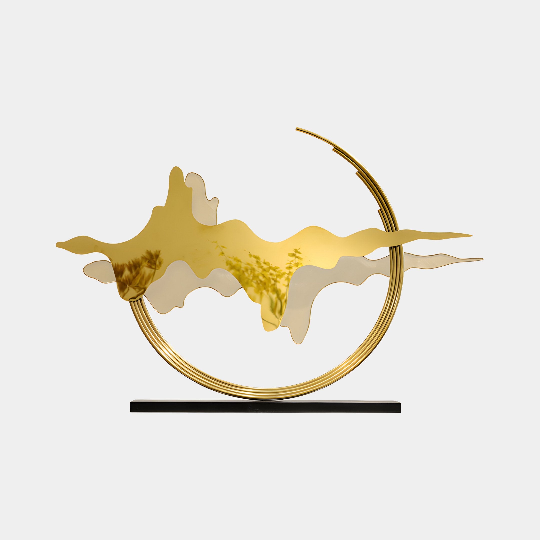 The Horizon Gold Abstract Sculpture's curved design set against a white background, emphasizing its flowing gold forms.