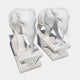 Two 180cm marble outdoor sculptures named Lucky Chinese Elephant II by Giant Sculptures stand side by side on decorative bases, capturing an intricately carved walking posture and embodying a rich cultural heritage.