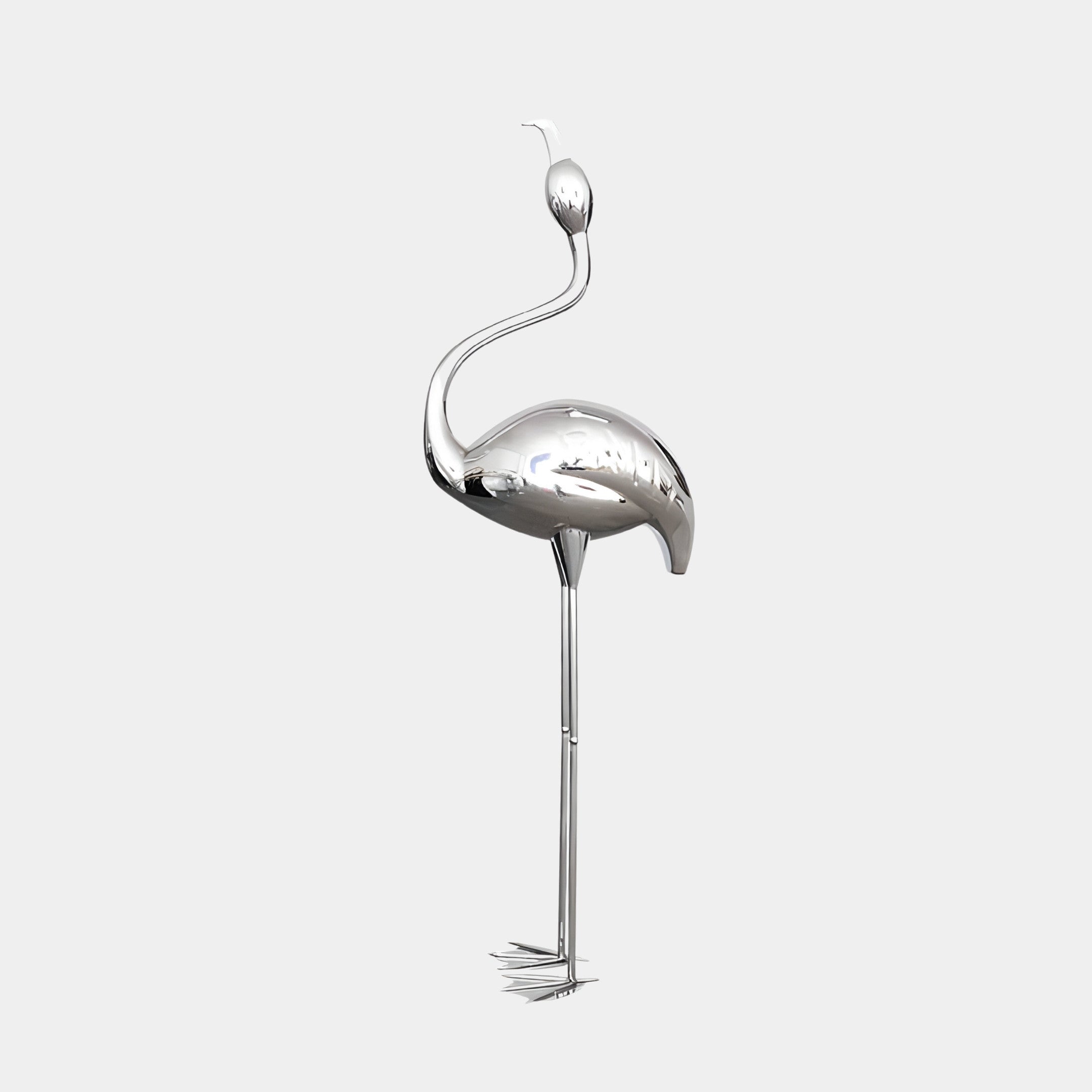 A stainless steel flamingo sculpture standing tall on thin legs, mounted on a black base.