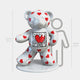 The Gacko Keith Haring White Bear Sculpture by Giant Sculptures is a limited edition pop art masterpiece. Standing 165cm tall, this white bear with red hearts and a heart illustration on its chest captures the vibrant style of Keith Haring, with a silhouette accentuating its impressive stature.