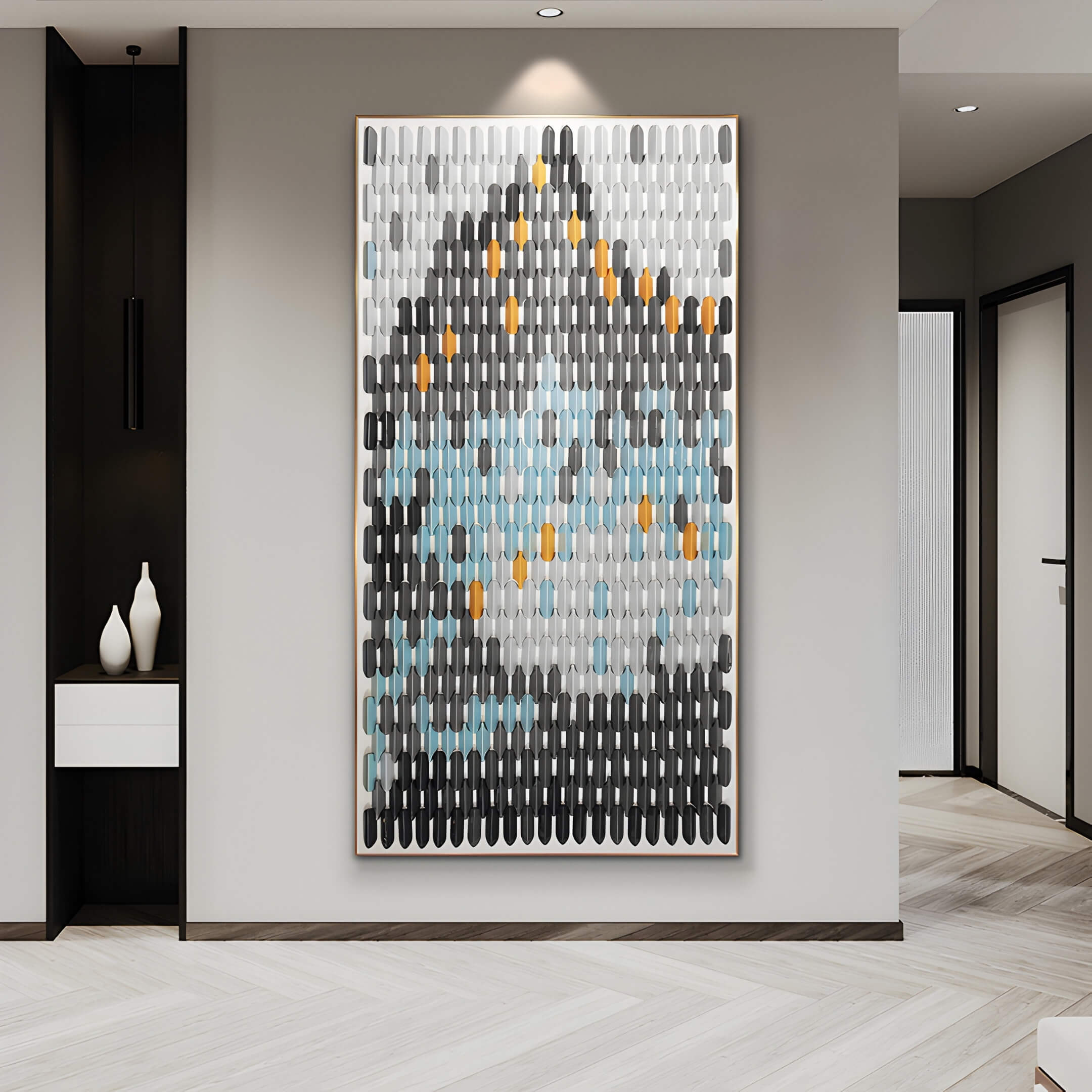 Large-scale black, grey, and blue ceramic wall art installed in a modern hallway. The geometric tile arrangement creates a dynamic and elegant focal point in the space.