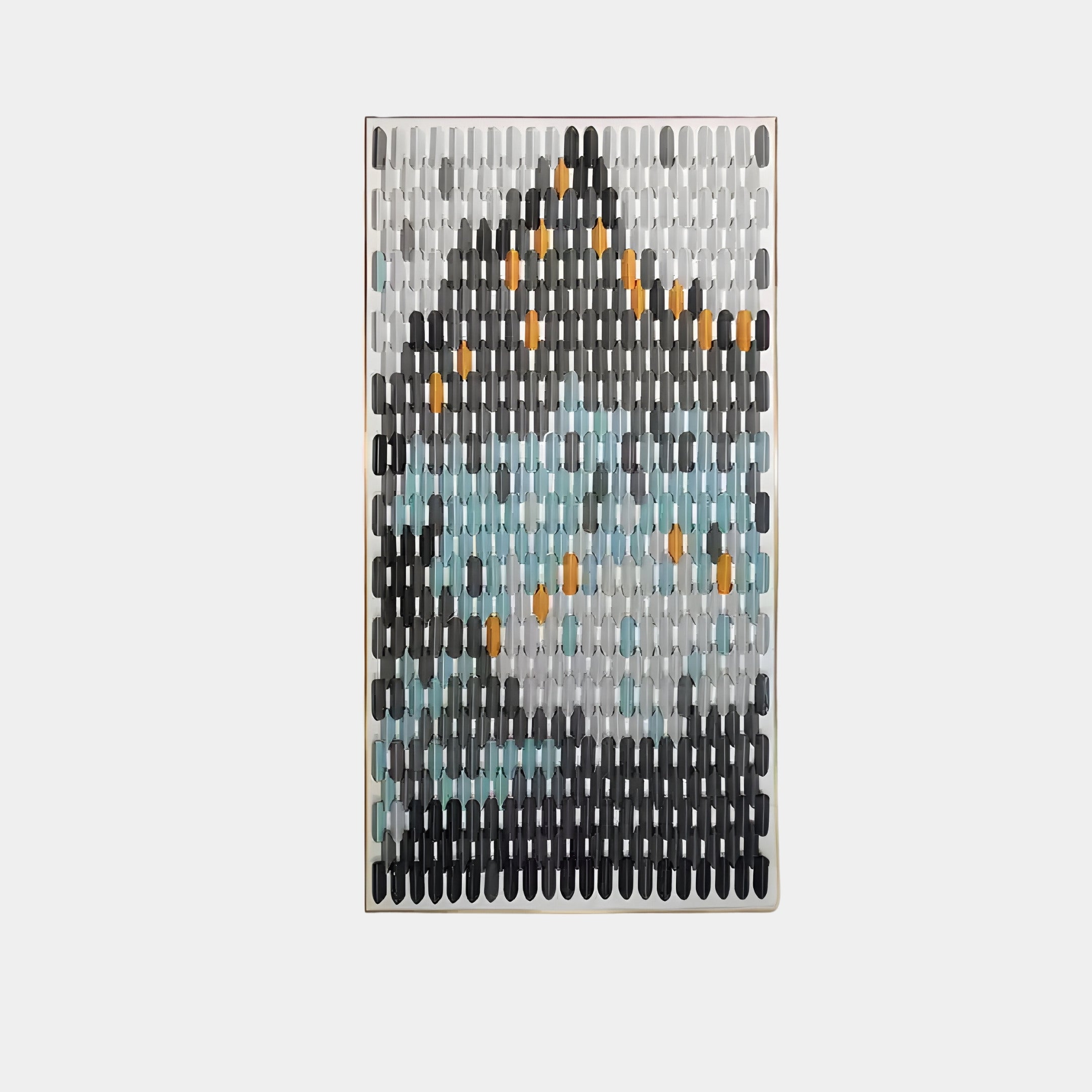 Modern wall sculpture with a mountain-inspired abstract design, featuring glossy ceramic tiles in black, grey, blue, and orange tones arranged in vertical rows. Framed contemporary artwork.