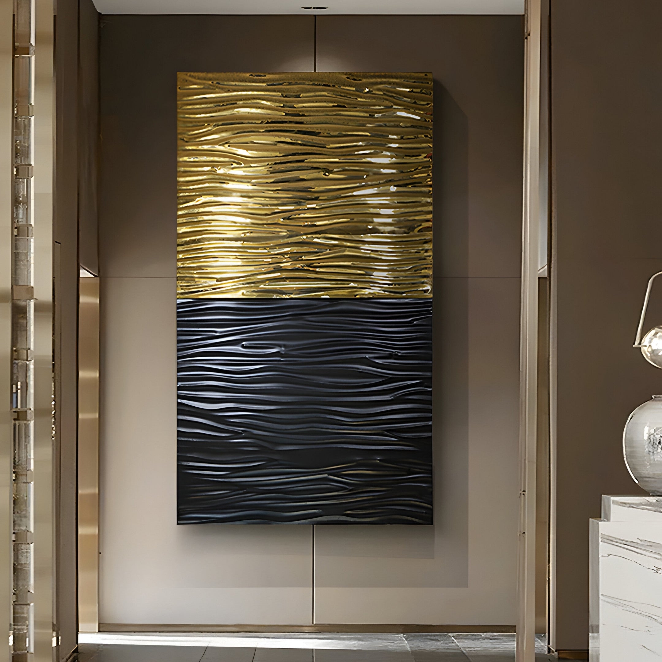 The Ripple Dual-Tone Black & Gold Textured Wall Art by Giant Sculptures enhances the room with its modern design featuring a textured gold top and sleek black bottom, framed to enrich neutral tones. Paired with a glossy lamp, its ideal for sophisticated modern living rooms.