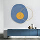 The Solaro Radiant Blue & Yellow Round Mural Wall Art by Giant Sculptures showcases a modern Nordic style with a large blue oval and a small yellow circle, partly overlapped by a thin metal ring. It pairs perfectly with sleek blue sideboards and minimalist pottery for Scandinavian decor elegance.