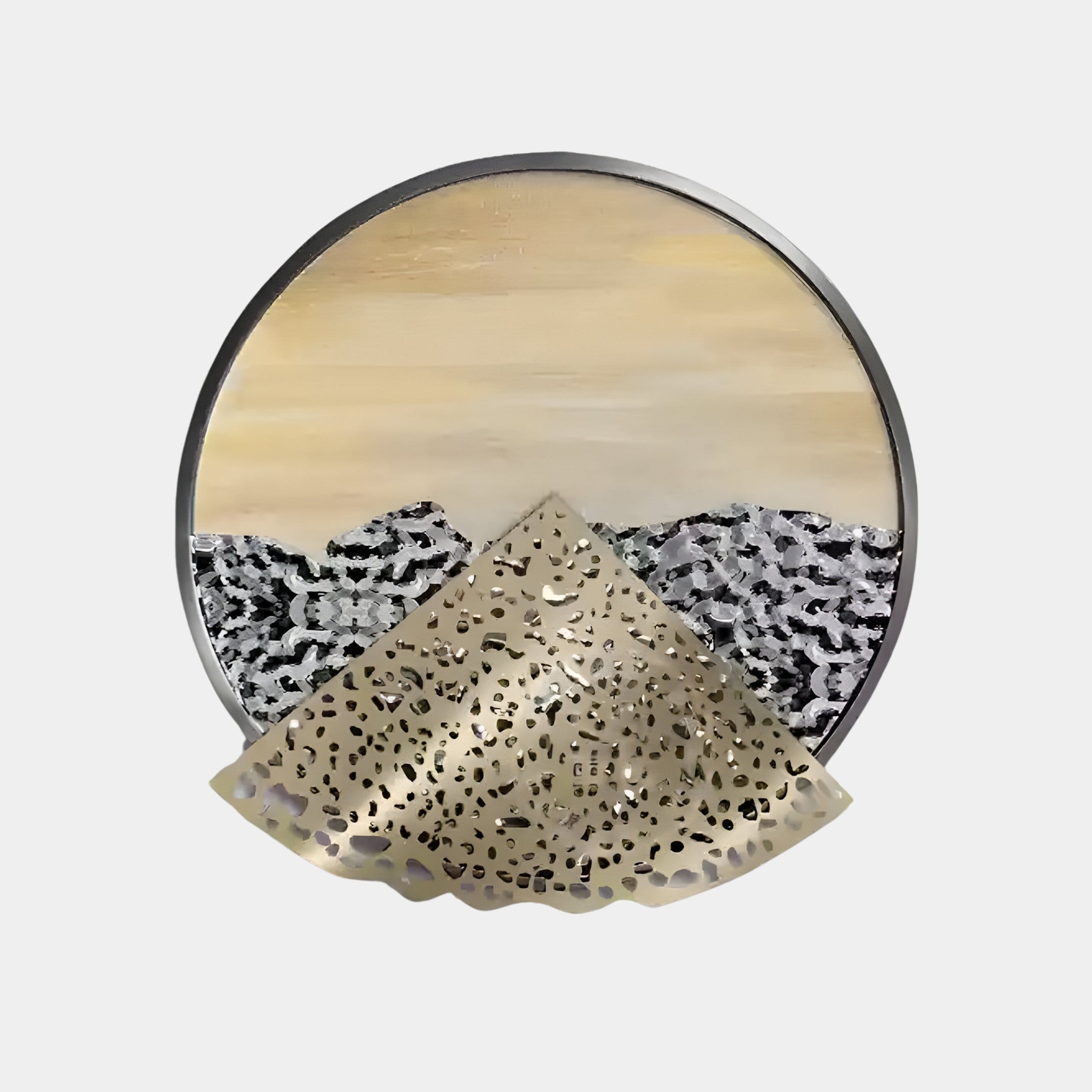 The Aurelio Bottom Metallic Layered Textured Round Wall Art by Giant Sculptures exudes modern elegance, featuring a yellow sky landscape with dark hills and a striking metallic triangular element in the foreground.