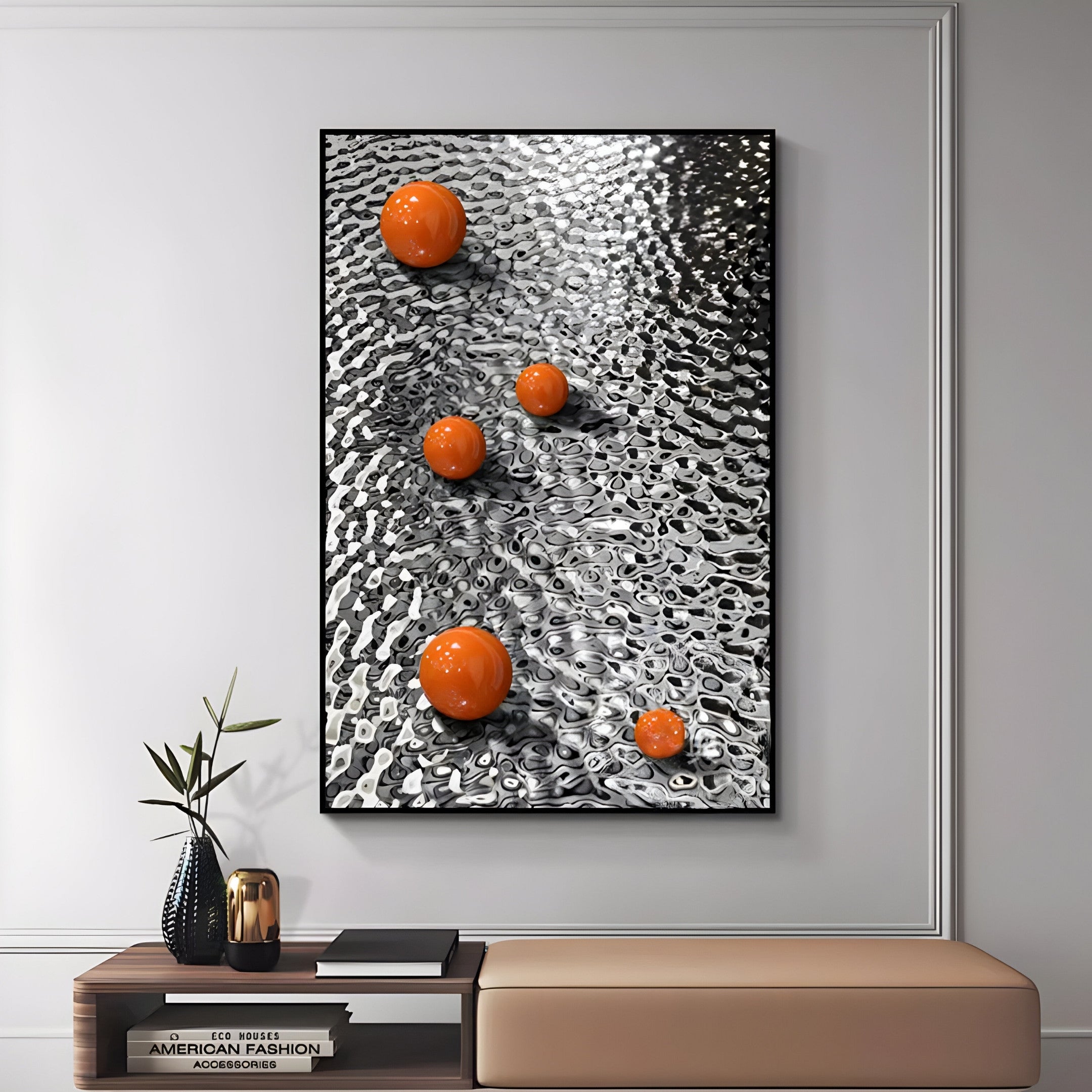 The Luminosa Orange Orb Textured Metal Wall Art by Giant Sculptures features a metallic ripple-effect backdrop and five diagonal orange orbs, beautifully enhancing a modern space with its abstract design against a white wall, beige bench, and small plant.