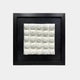 A framed 3D artwork featuring 25 soft, pillow-like white ceramic forms, symmetrically arranged in a grid on a black background. The delicate, rounded texture creates a soft yet structured aesthetic.