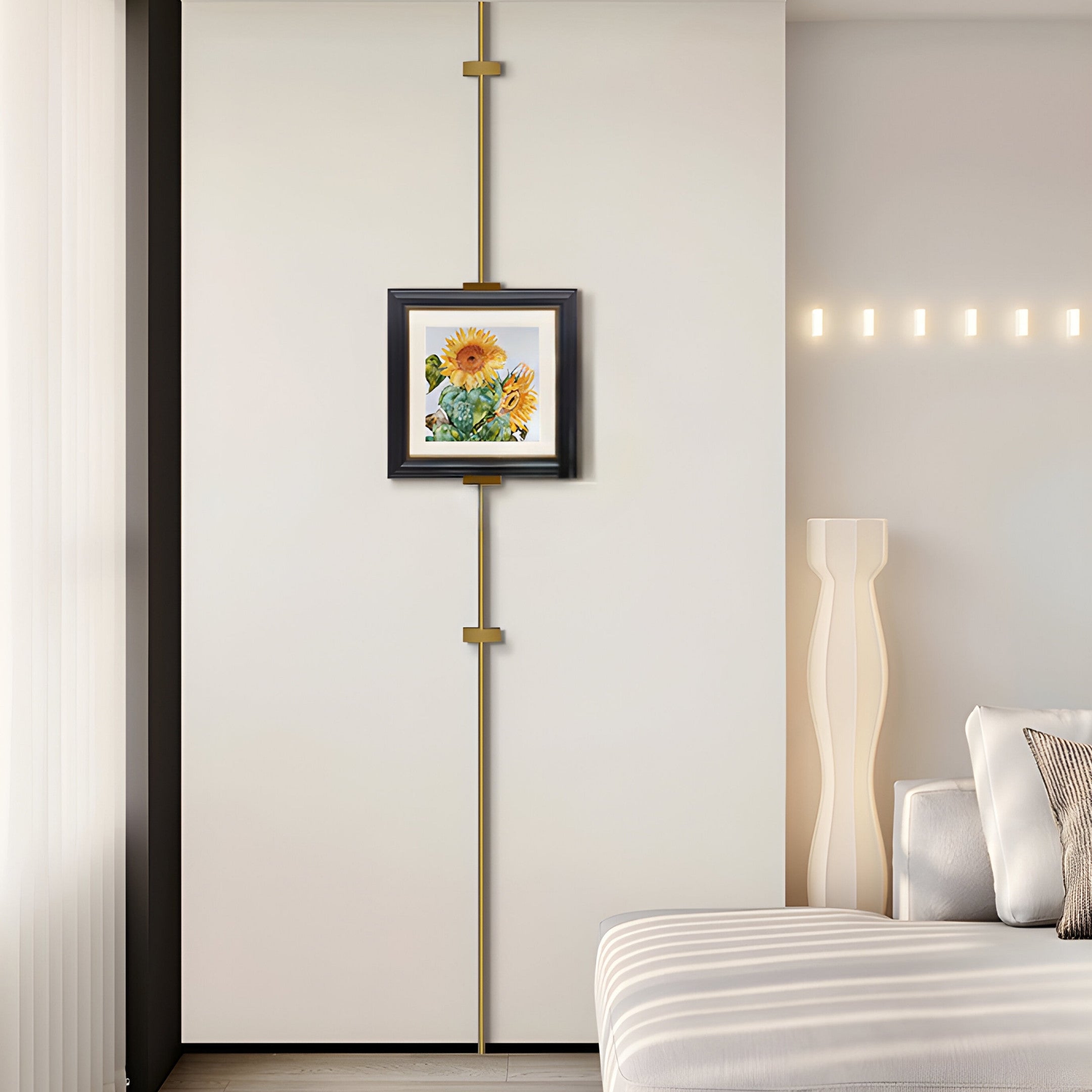 In a neutral-toned modern minimalist bedroom, the Ecliptica Sunflower Botanical Illustration Gold Frame Wall Art by Giant Sculptures is centered on a vertical accent line for botanical flair. The decor includes a white bed, soft pillows, and a chic floor lamp.