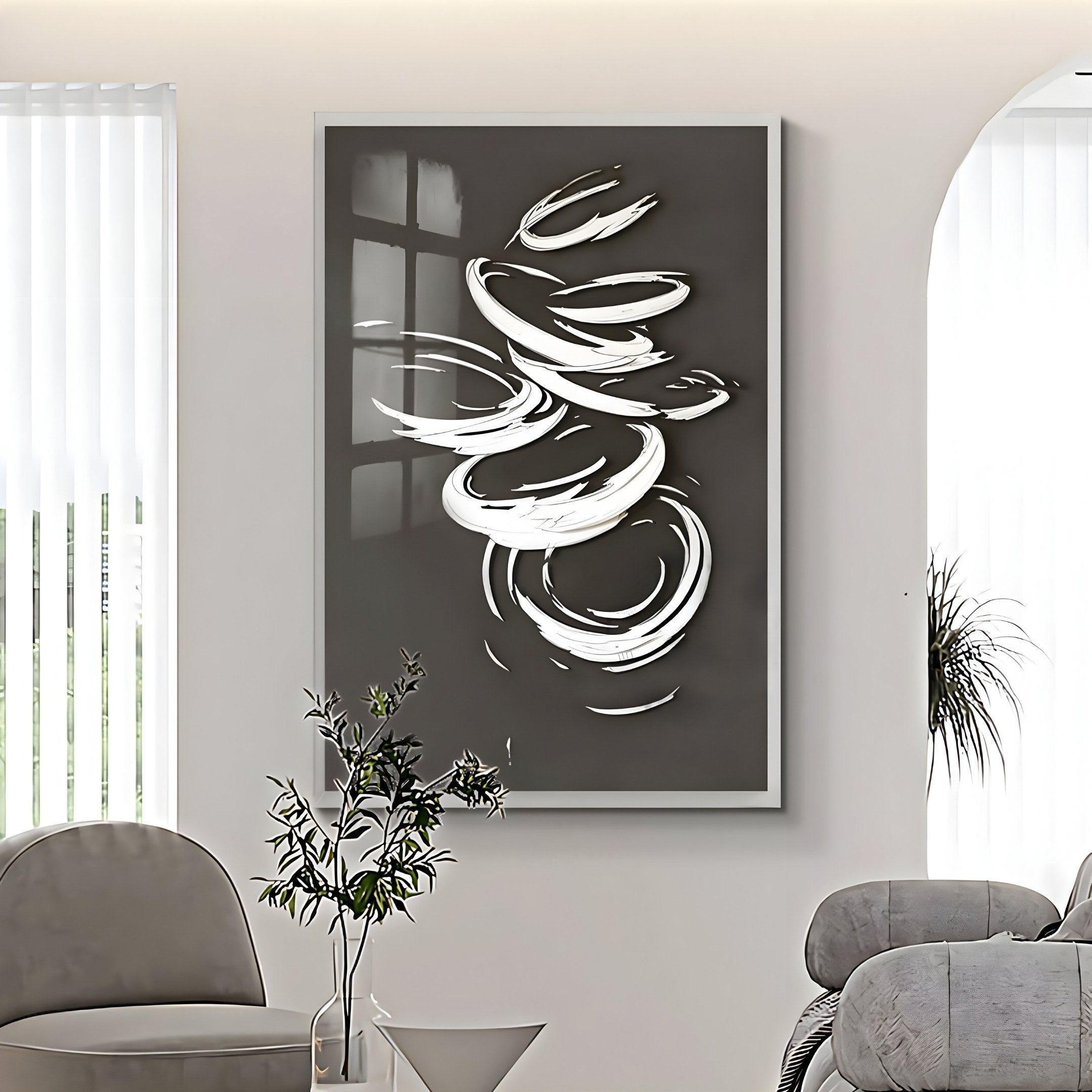 A modern living room features the Zephyr Monochrome Swirl Abstract Wall Art by Giant Sculptures, creating a striking 3D effect. A gray sofa nearby is complemented by a small plant on the coffee table, with natural light filtering through vertical blinds to enhance the serene ambiance.