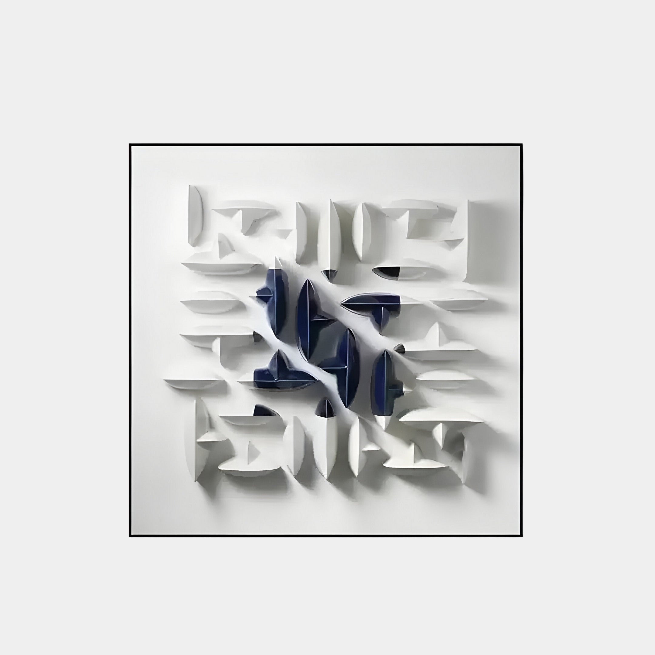 Modern abstract 3D wall sculpture with glossy navy blue and white ceramic shapes arranged on a square white frame. Geometric design casting artistic shadows.