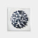 Modern 3D wall art with geometric blue forms arranged in a circular pattern on a white background.