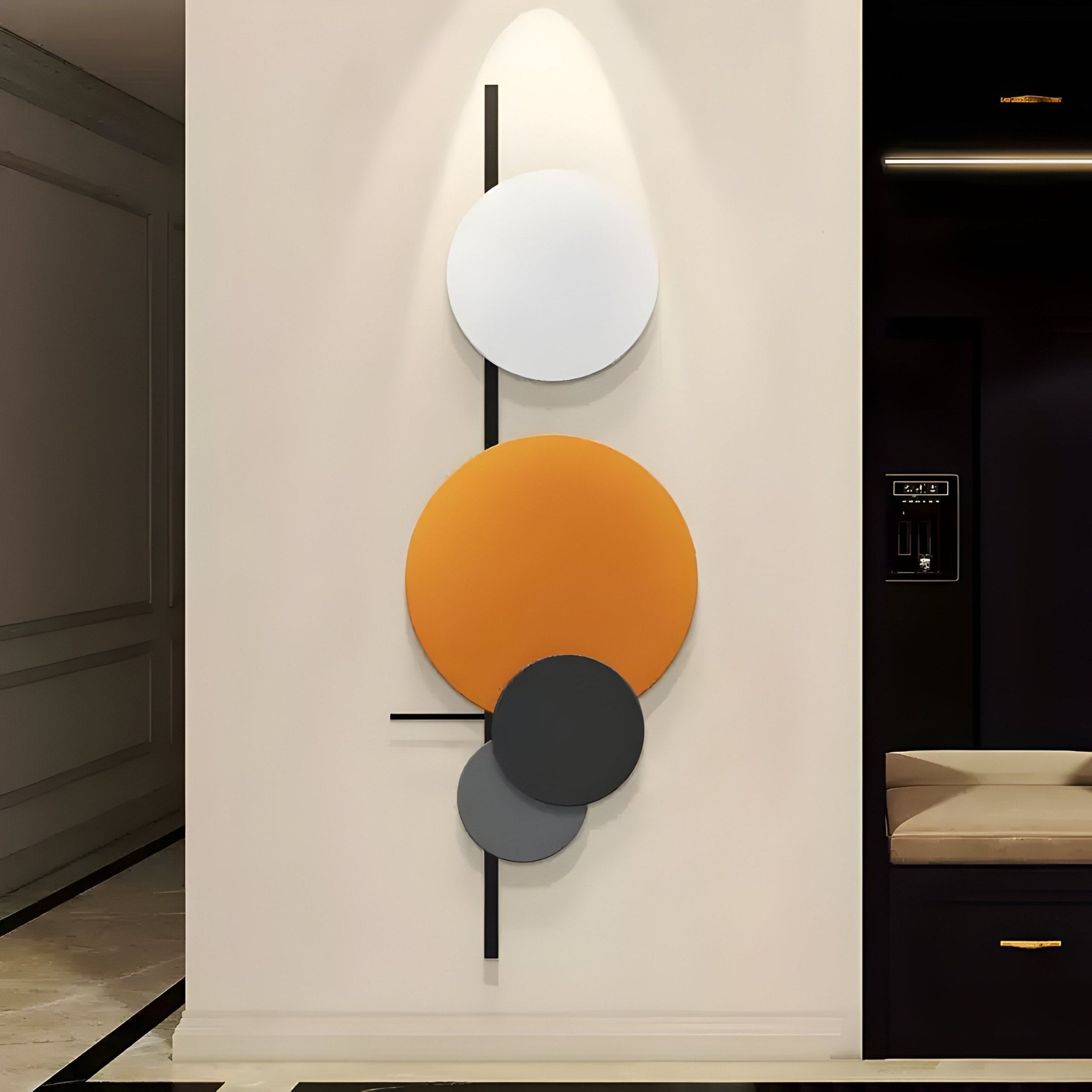 The Orbit II Dynamic Flow Multicoloured Circular Wall Art by Giant Sculptures is ideal for modern interiors, showcasing overlapping shapes: a white oval, an orange circle, and two smaller black circles on vertical black lines against a light background.