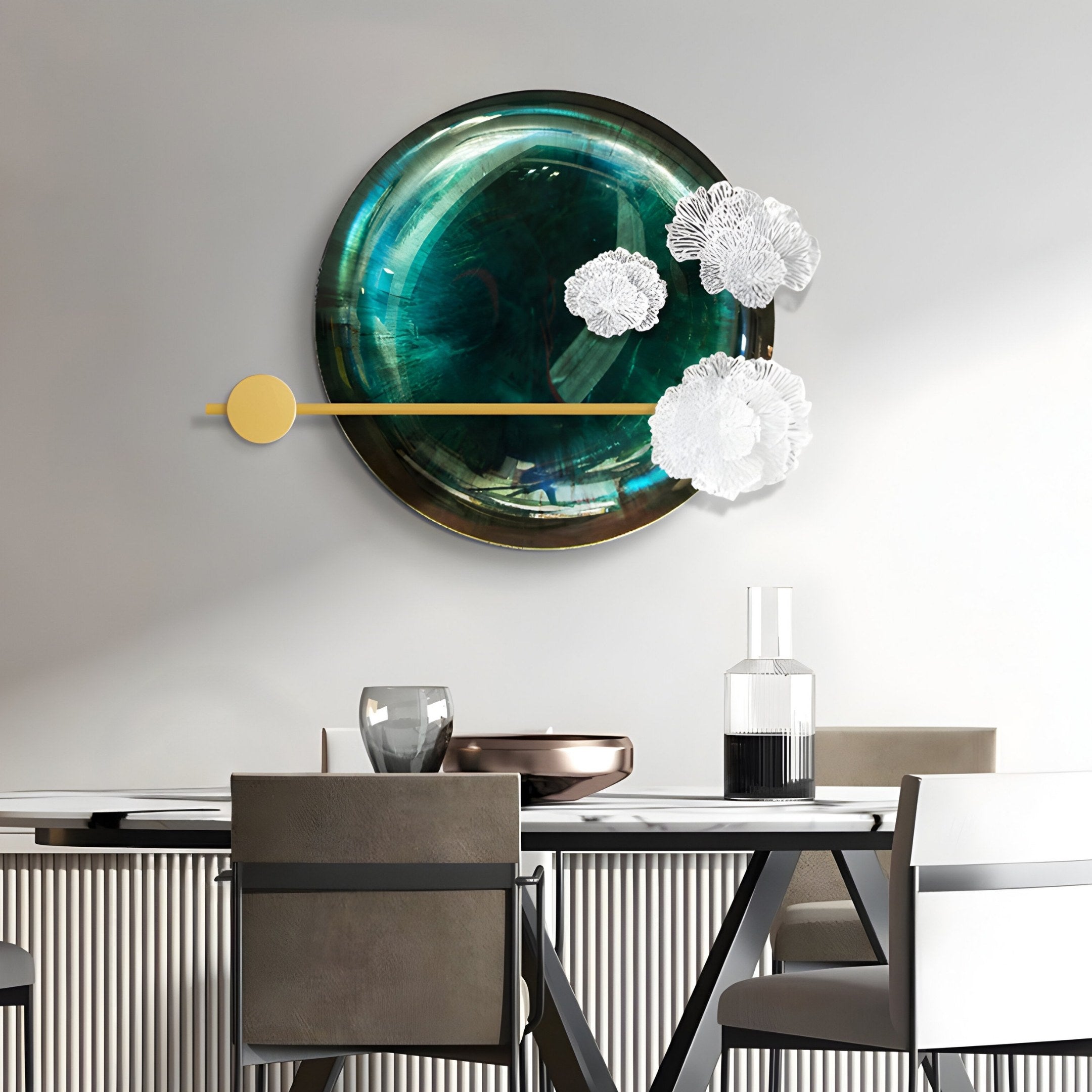 A modern dining area adorned with the Nova Floral Radiant Emerald Green Circular Wall Art from Giant Sculptures. The table features a tall glass bottle and a metallic bowl, complemented by four chairs in neutral tones and minimalist design, enhancing the luxury interiors.