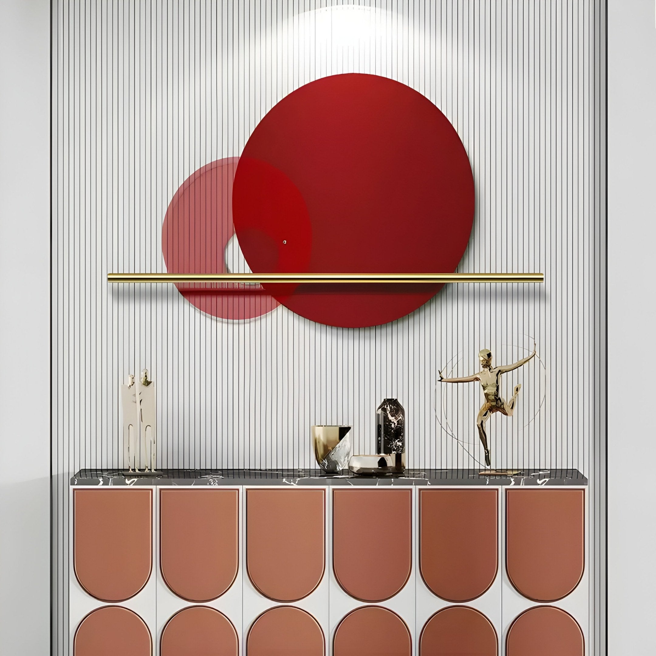 A modern interior features the Luna Forma Scarlet Red Round Brass Accent Wall Art by Giant Sculptures. Below, a geometric-patterned cabinet displays a metallic archer figurine and minimalist objects, epitomizing modern decor.