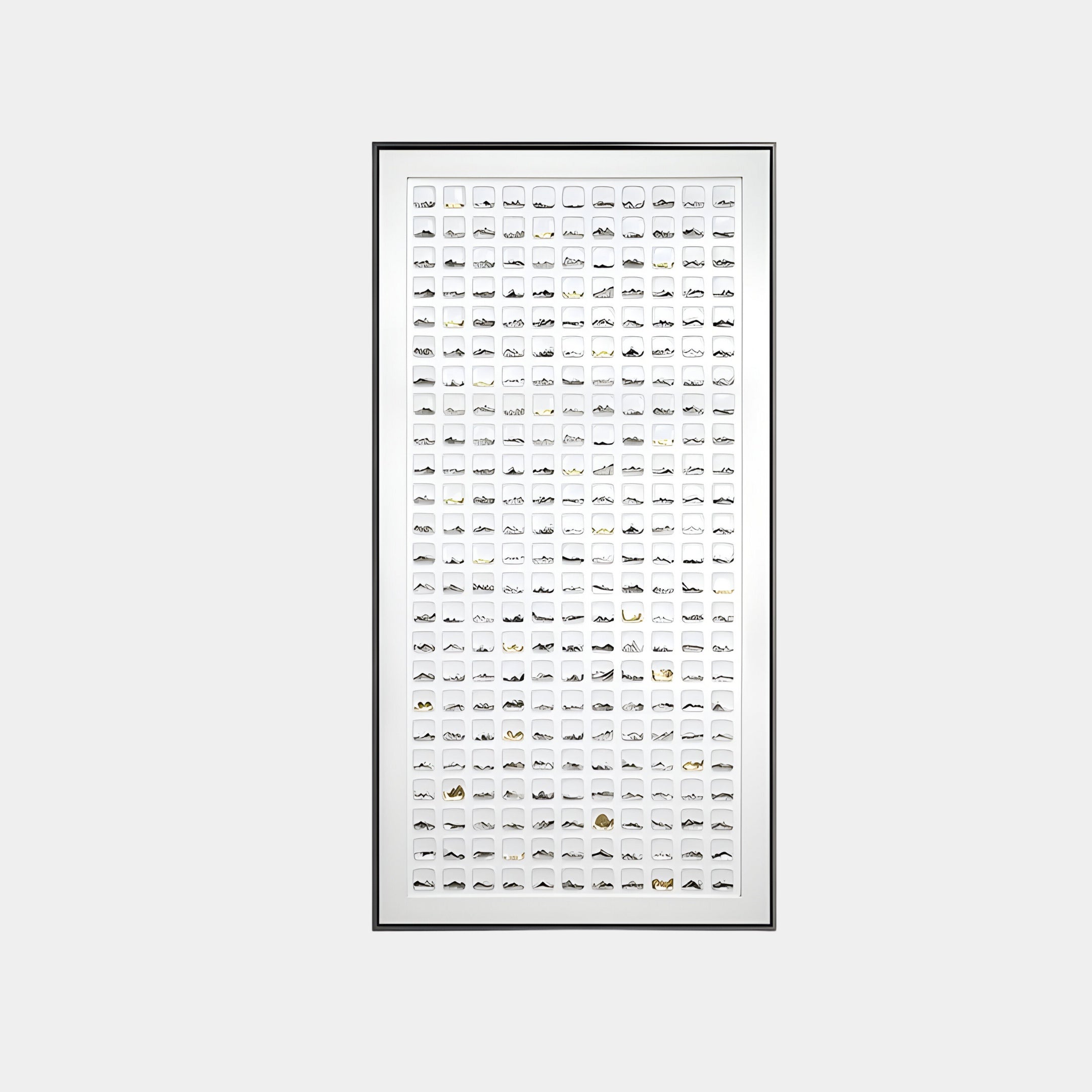 Minimalist white wall art installation featuring abstract black and gold patterns, composed of square ceramic tiles mounted in a black and white frame, ideal for modern interiors.