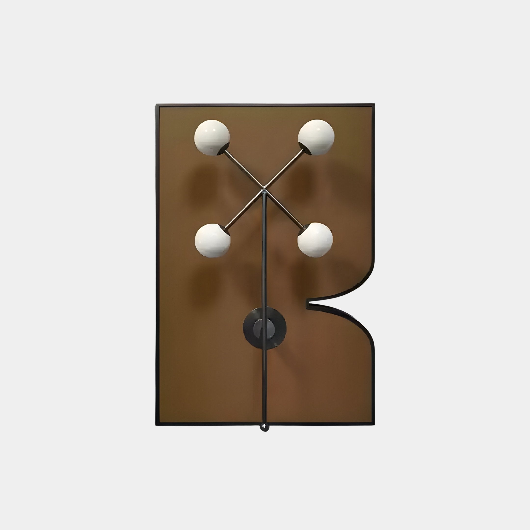 The Axial Elegance Bronze Symmetrical Metal Wall Art by Giant Sculptures is a modern wall sconce with a brown irregular backplate. Four white globes in a cross pattern are connected by black rods, resembling modern wall art.