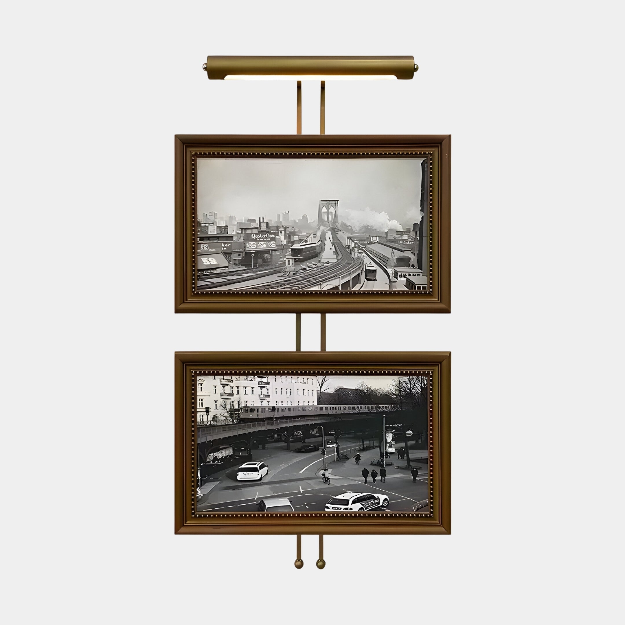 The Artisera Urban Vistas Antique Dual Frame Built-In Light Wall Art by Giant Sculptures exudes timeless charm with two sepia-toned photographs. The top captures a bridge, and the bottom showcases urban scenes of cars and buildings, all enclosed in ornate frames displayed vertically.