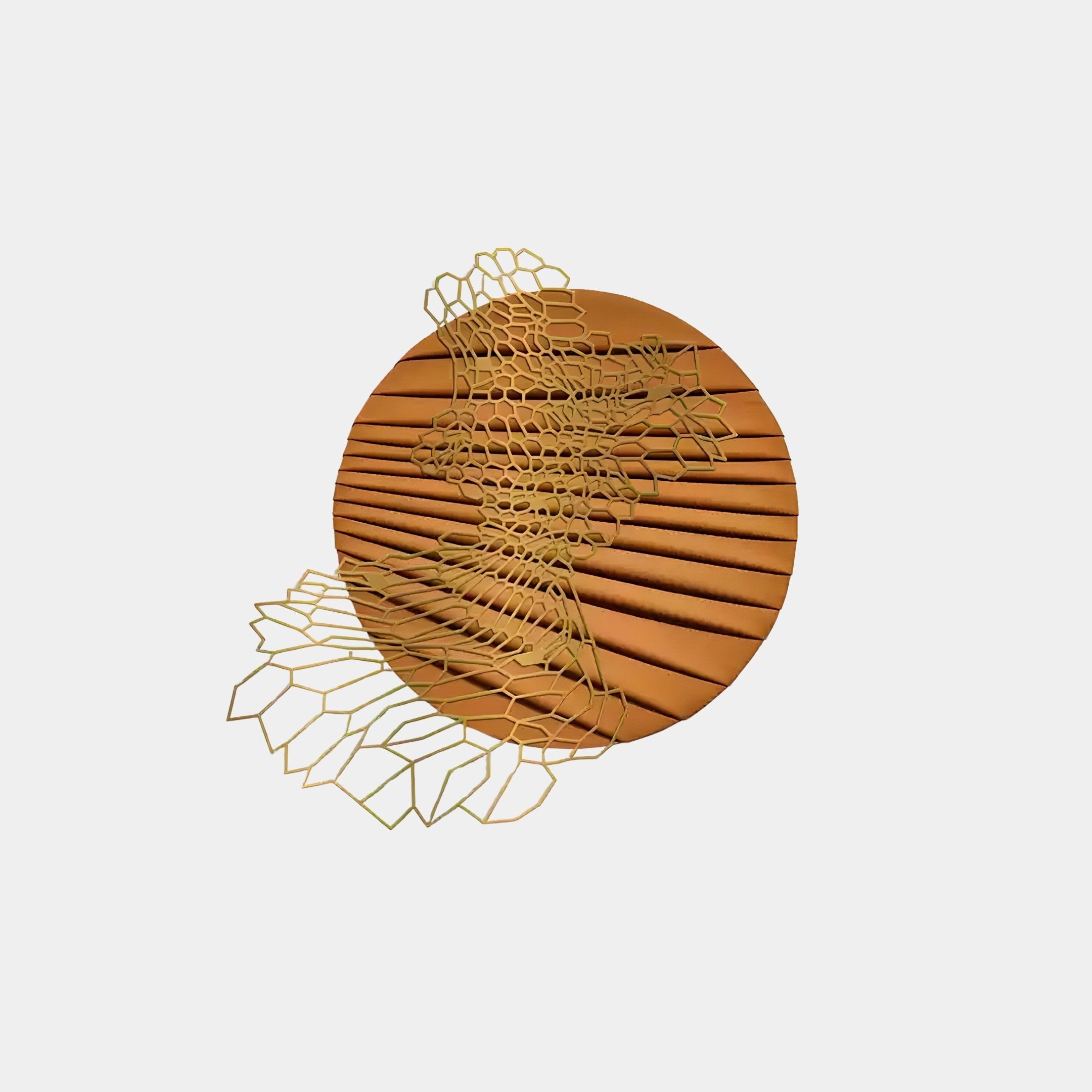 The Auramesh Sunset Orange-I Metal Winged Circular Geometric Wall Art from Giant Sculptures is a brown circular piece with horizontal ridges overlaid by an abstract gold wireframe honeycomb design, creating striking geometric decor against a solid off-white background for contemporary homes.