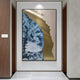 The Astrid Azure Flow Gold Abstract Wall Art by Giant Sculptures, with blue, gold, and white swirls and a hand-painted oil finish, enhances a modern hallway adorned with wooden walls and a marble floor.