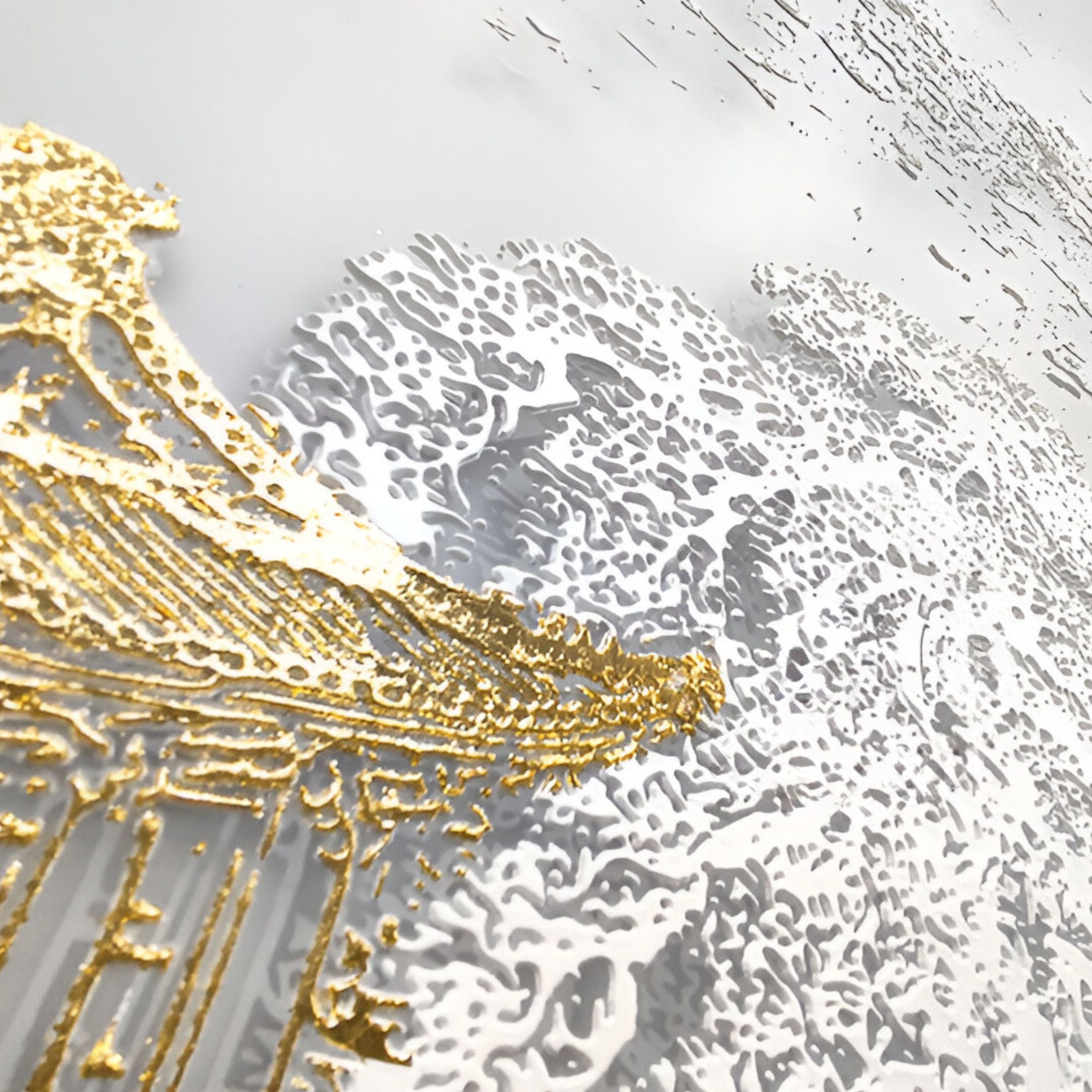 Close-up of textured gold detailing on a decorative panel, highlighting intricate craftsmanship and artistic elegance.