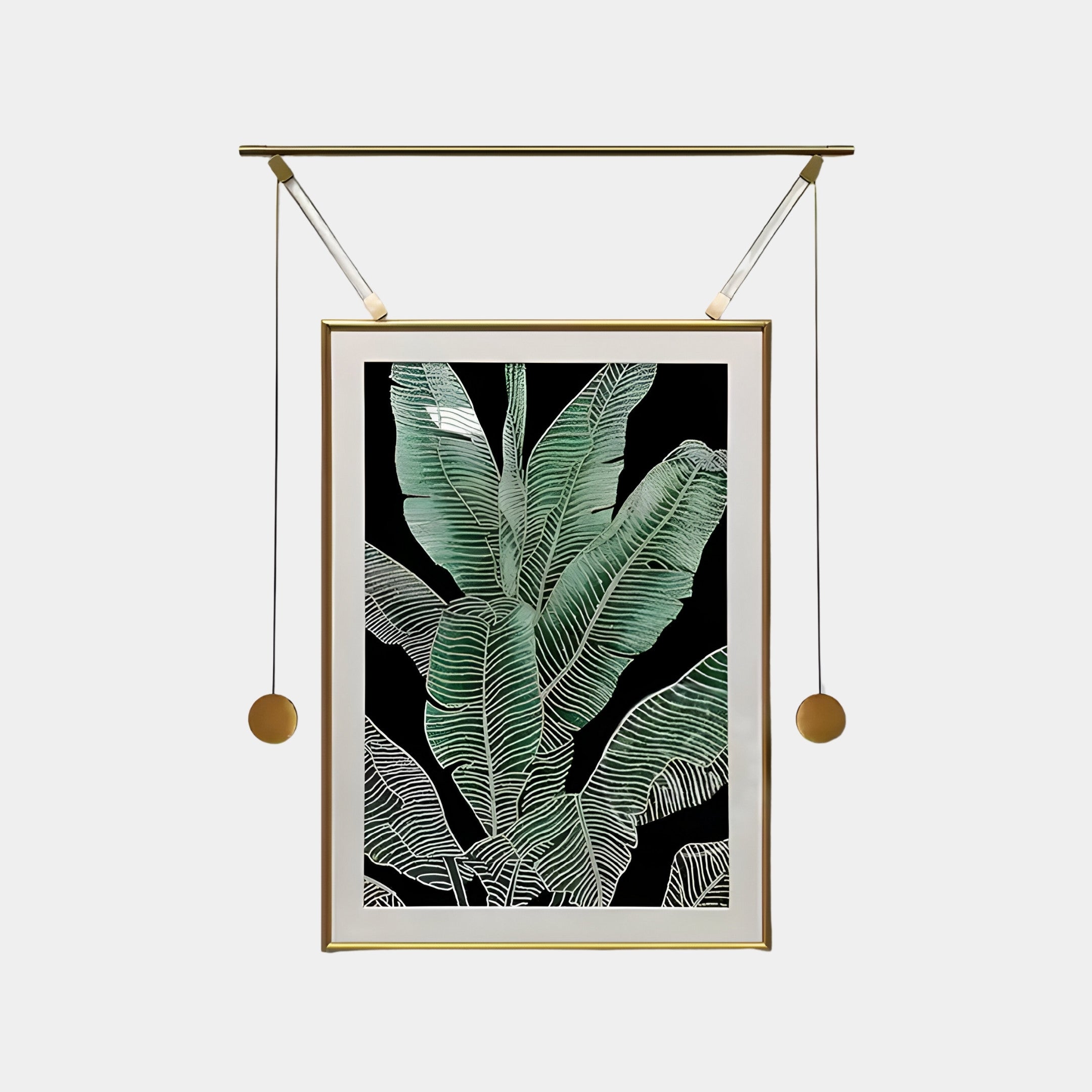 The Giant Sculptures Glacia Green Botanical Crystal Hanging Framed Wall Art features stylized green leaves with white outlines on a black background. It elegantly hangs in a unique gold frame with suspended rods and round weights on either side, offering a contemporary touch to any space.