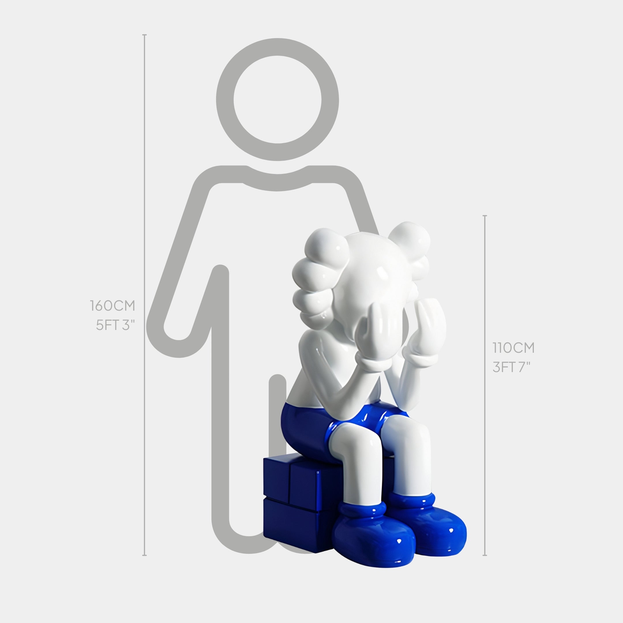 The White & Blue Iconify Melancholy Sitting Sculpture by Giant Sculptures, at 110 cm, shows a figurine with its face in its hands, ideal for contemporary interiors or luxury showrooms. A silhouette with markers at 160 cm and 110 cm behind it provides height comparison.