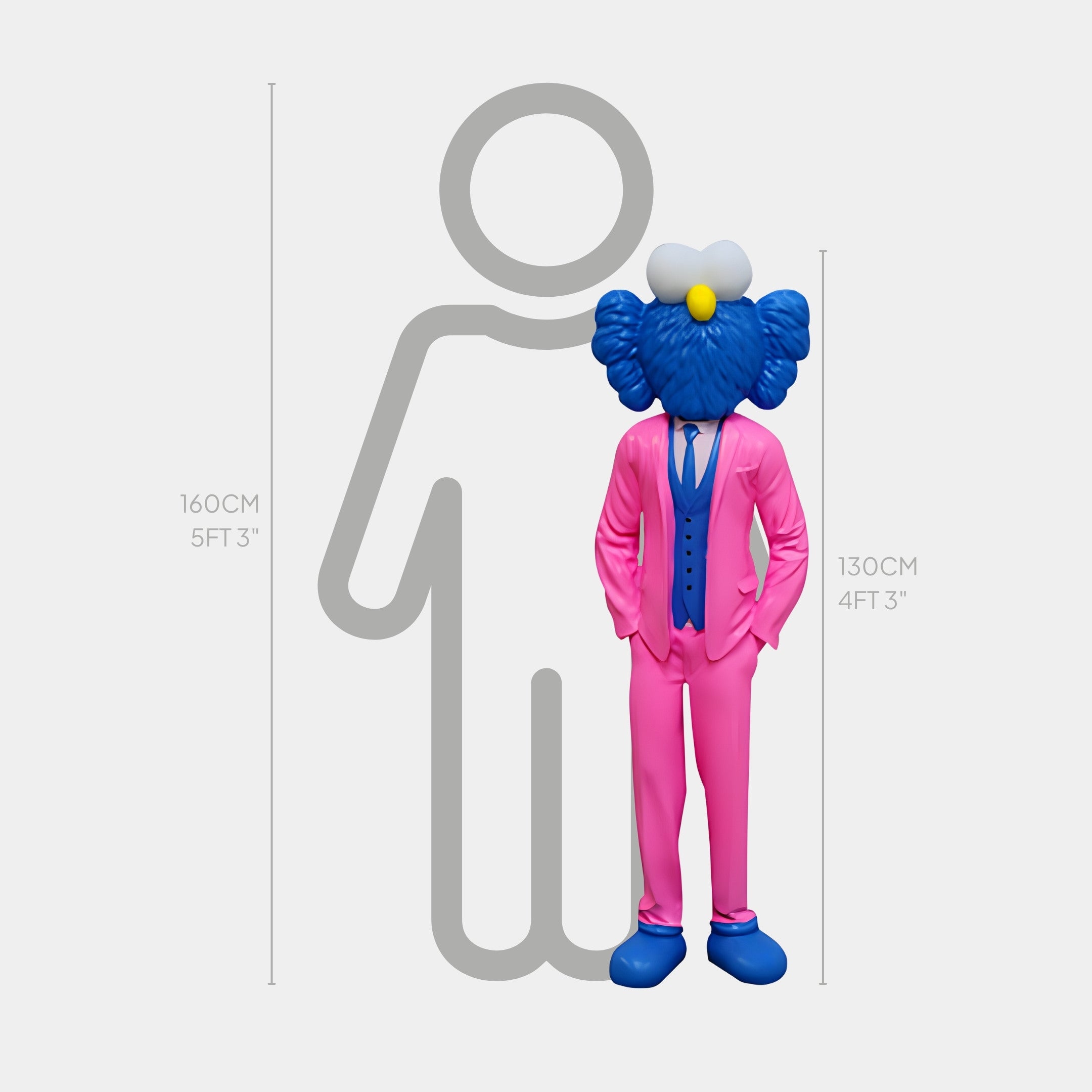 A blue cartoon character with white eyes, wearing a vibrant fuchsia suit and blue tie, stands next to a Giant Sculptures Iconify CEO sculpture. The character is 130 cm (4 ft 3 in), contrasting with the contemporary art-inspired gray outline at 160 cm (5 ft 3 in).