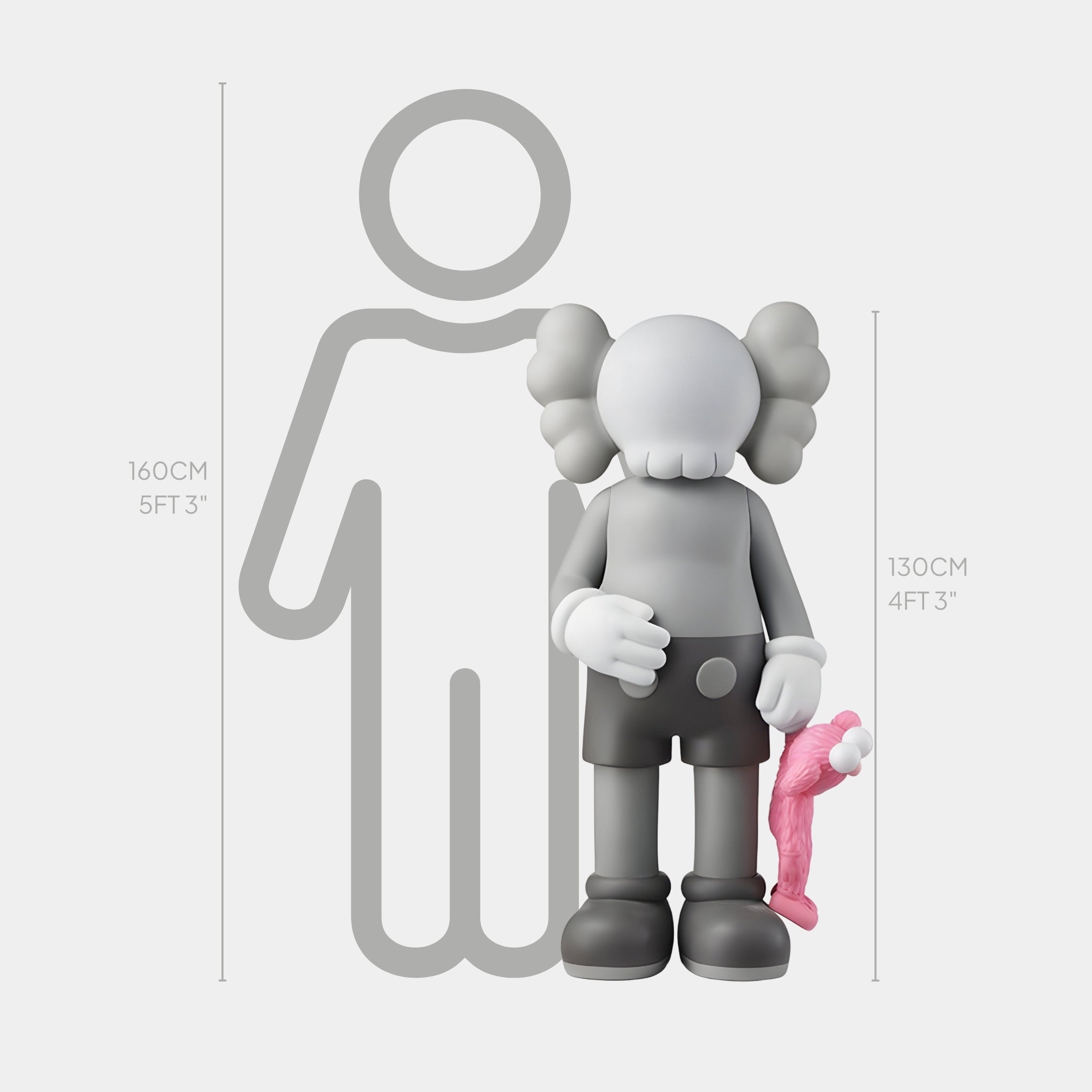 The Soft Grey Iconify Pink Furry Toy Sculpture by Giant Sculptures shows a gray figure with crossed-out eyes and cartoonish traits holding a smaller pink toy. Both have gloved hands. The larger sculpture measures 130 cm, while the silhouette behind reaches 160 cm, highlighting contemporary artistry.