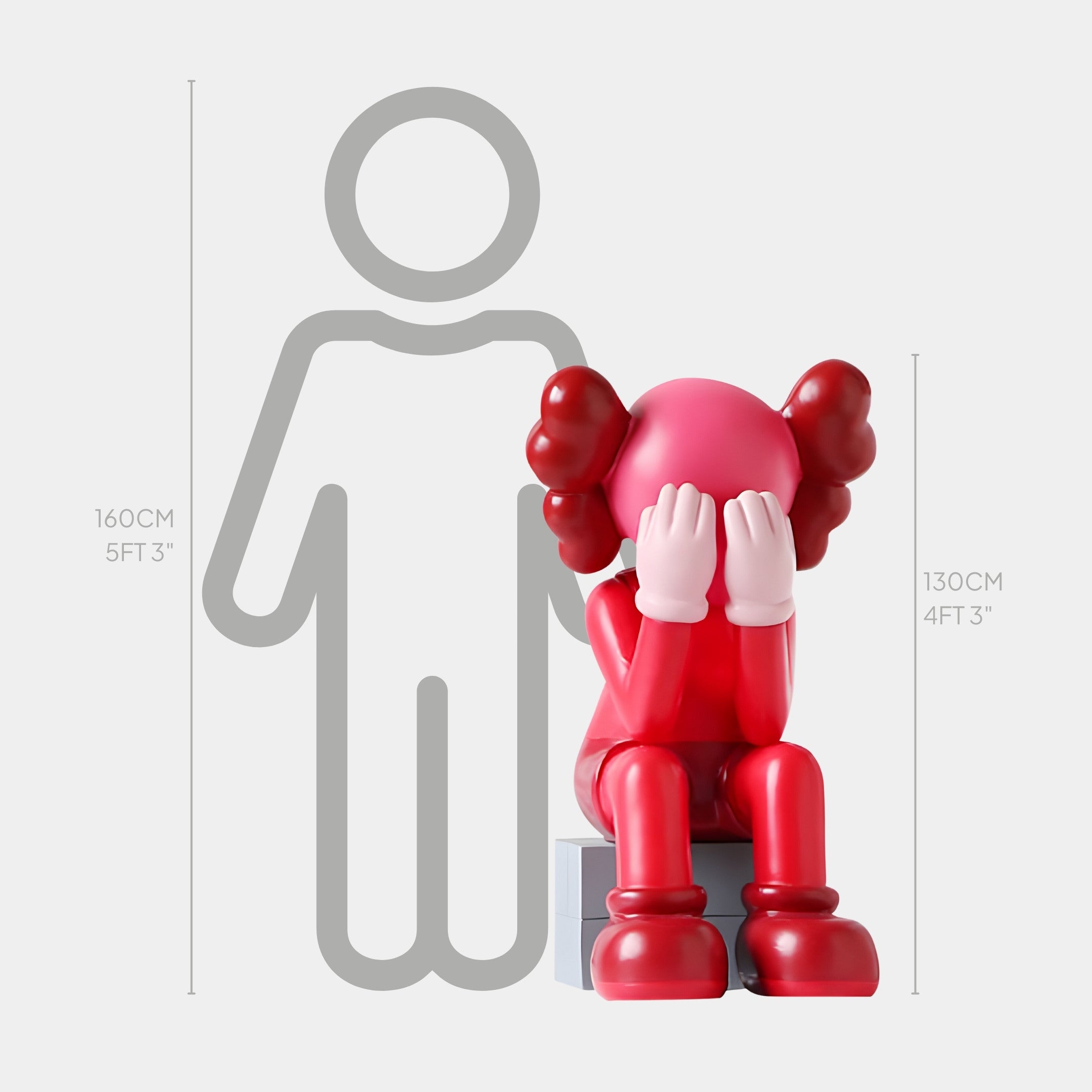 The Blush Ruby Iconify Melancholy Sitting Sculpture by Giant Sculptures is a vibrant 130 cm piece featuring a figure with hands over its eyes on a step. A 160 cm grey human outline next to it offers scale, inviting reflection and emotion in any contemporary space.