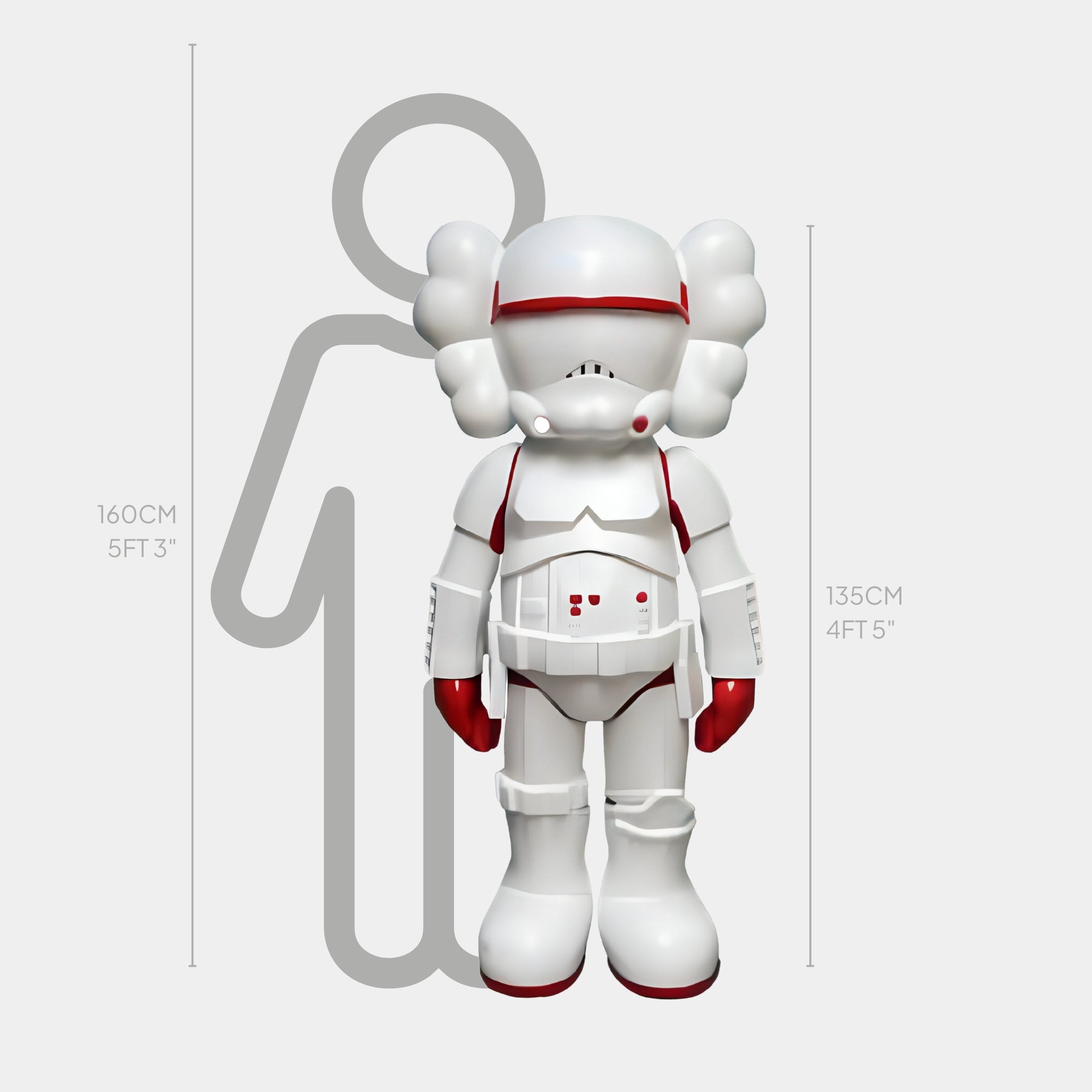 A white and red astronaut-like figure displays avant-garde artistry beside a height comparison silhouette. The Red Iconify Enforcer Sculpture by Giant Sculptures stands at 135 cm (4 ft 5 in), while the silhouette measures 160 cm (5 ft 3 in).