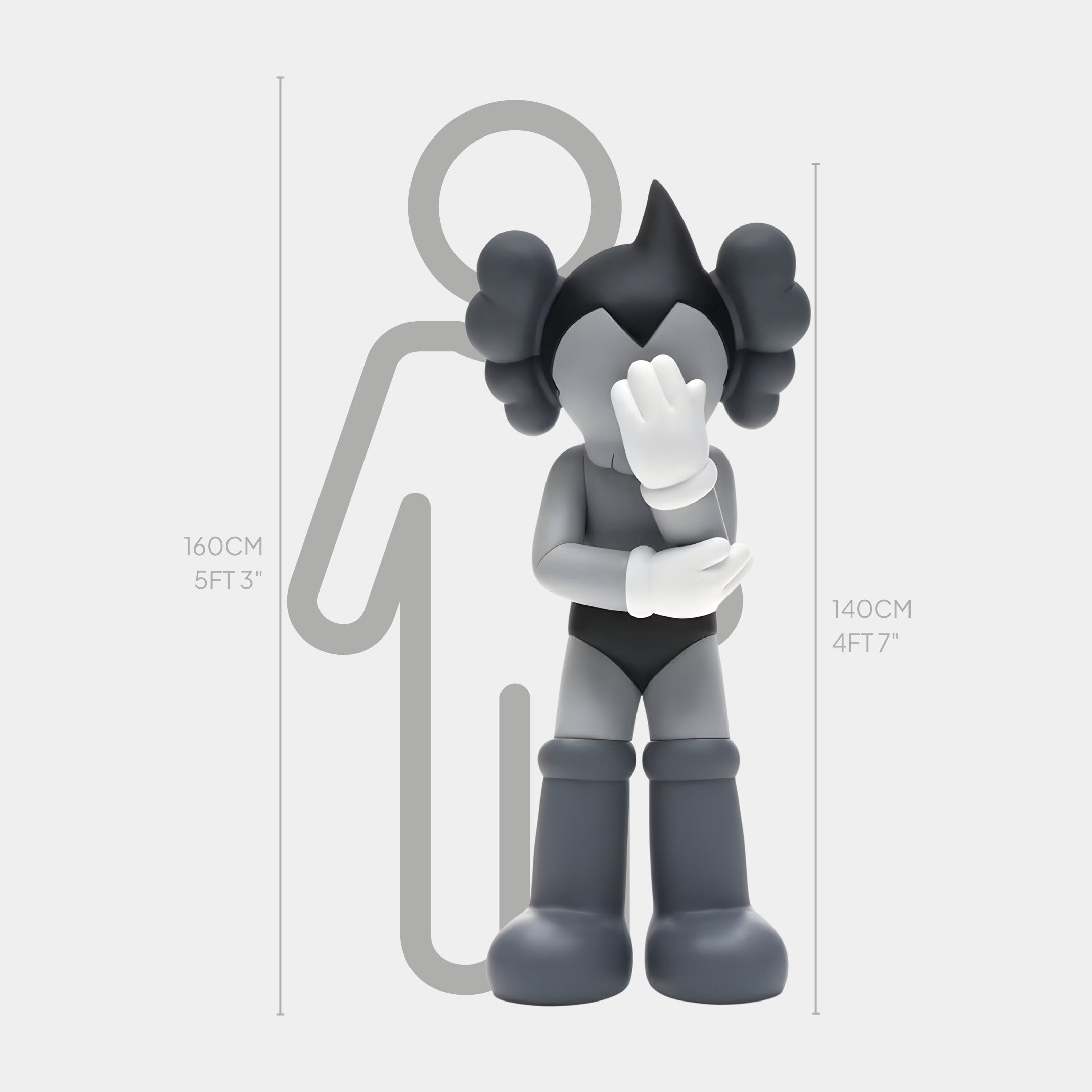 A grayscale cartoon character covers its face, resembling the minimalist allure of Giant Sculptures Steel Grey Iconify Cosmic Boy Sculpture - 140cm, with a nearby silhouette accentuating their size difference: 140 cm (4 ft 7 in) versus 160 cm (5 ft 3 in).