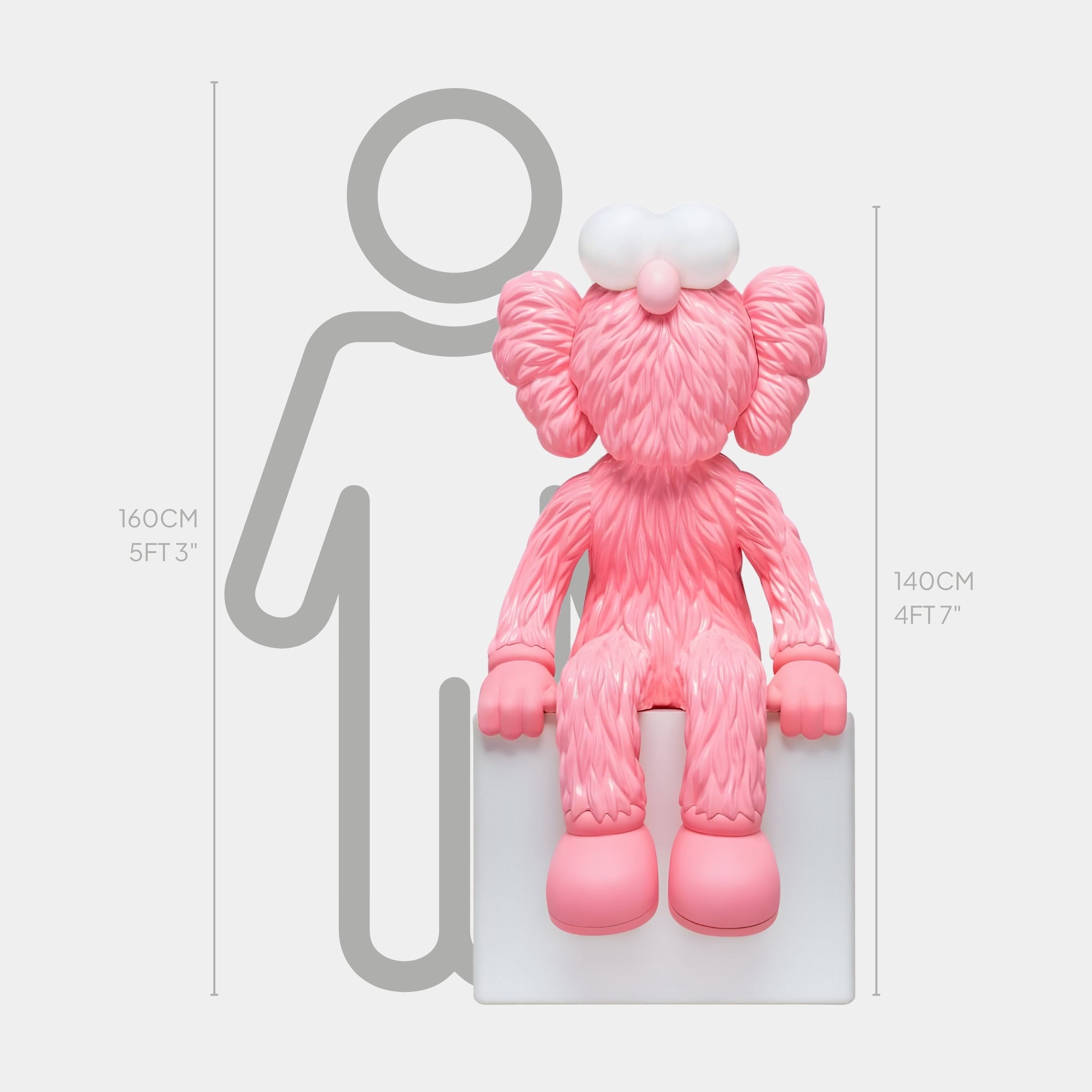 The Pedal Pink Iconify Furry Sitting Sculpture by Giant Sculptures, measuring 140 cm, showcases oversized feet and cloud-like ears. This contemporary art piece rests on a white block with a backdrop silhouette displaying height markers at 160 cm (5 ft 3 in) and 140 cm (4 ft 7 in).