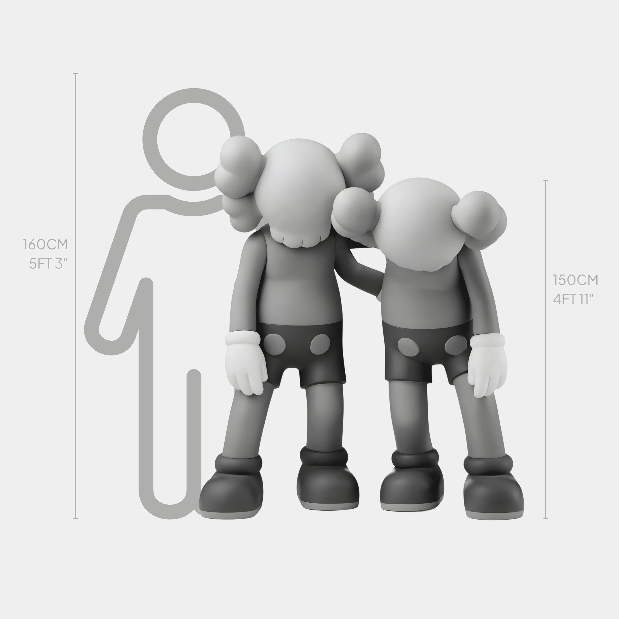 Two cartoon-like figures with round heads and X eyes stand in grayscale. Resembling the 150cm Steel Grey Iconify Friendship Sculpture by Giant Sculptures, one figure has an arm around the others shoulder. A simplified human outline offers a height comparison: 160cm and 150cm.