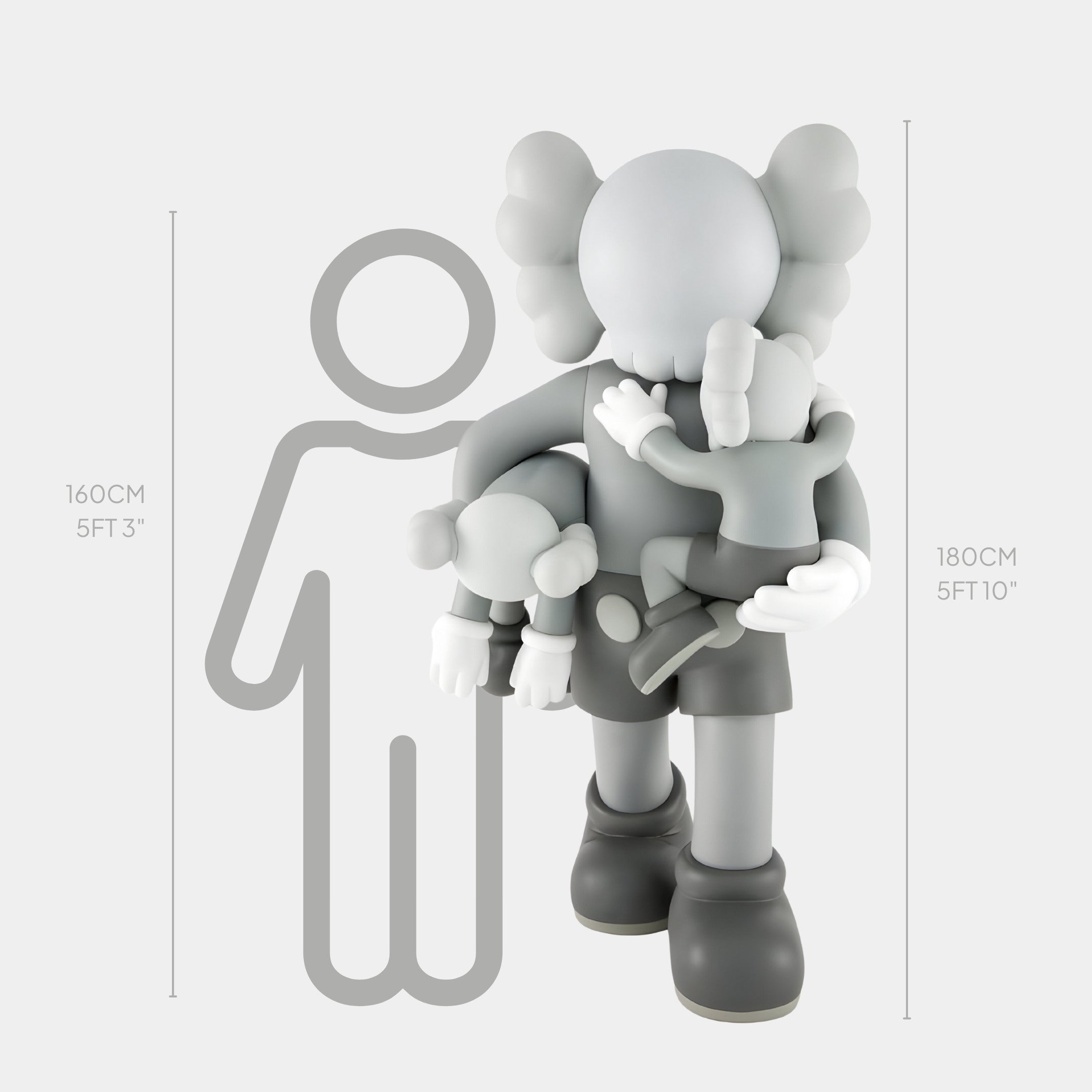 The Soft Grey Iconify Family Sculpture - 180cm by Giant Sculptures, features a gray cartoon-like figure holding two smaller figures, resembling a family. Beside it, a stick figure outline compares heights of 160 cm (5 ft 3 in) and 180 cm (5 ft 10 in), adding contemporary art flair to any minimalist décor.