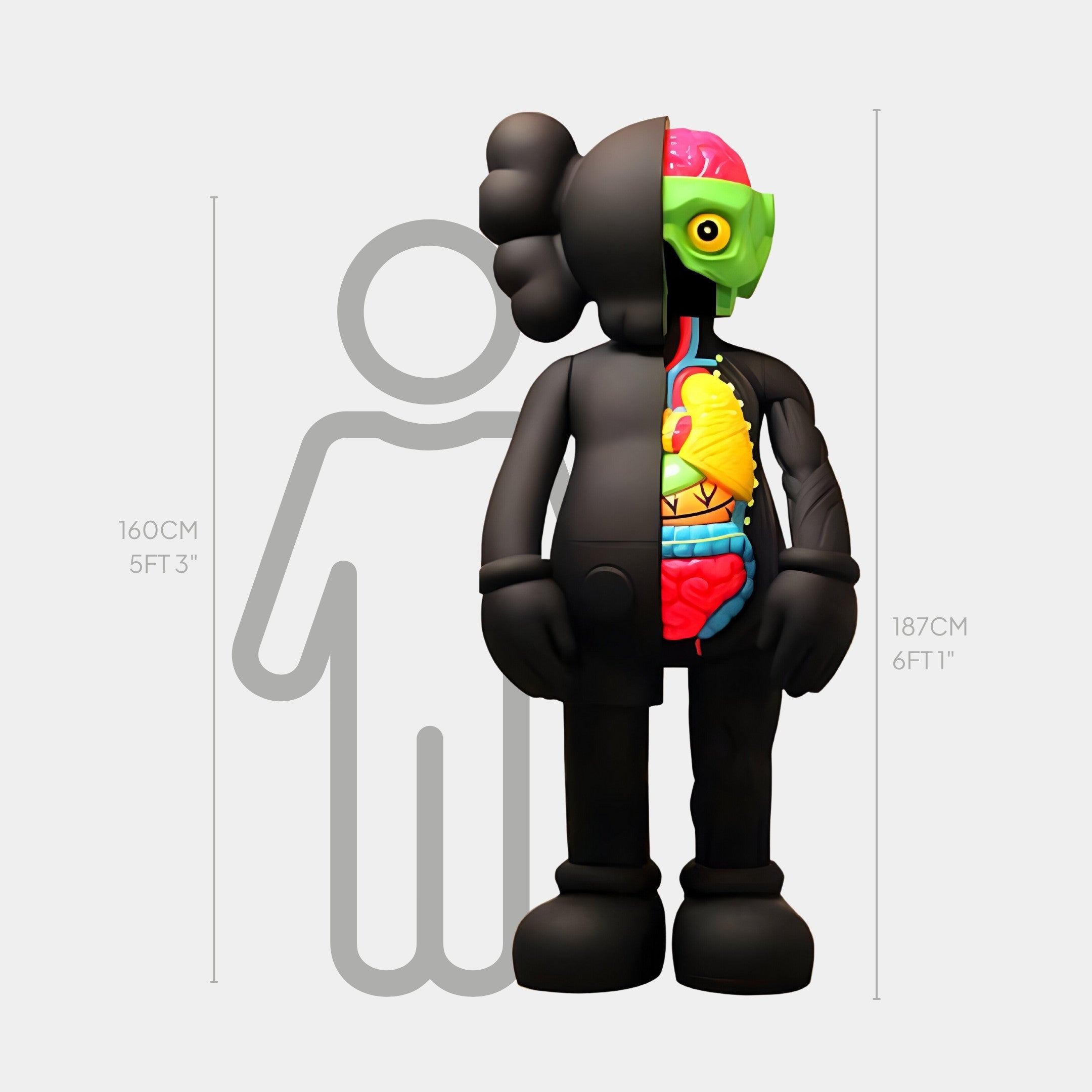 The Giant Sculptures Midnight Black Iconify Anatomy Sculpture stands at 187cm, featuring a split-view design: the left is a solid black cartoon character, while the right reveals colorful anatomical details like muscles, brain, and organs.