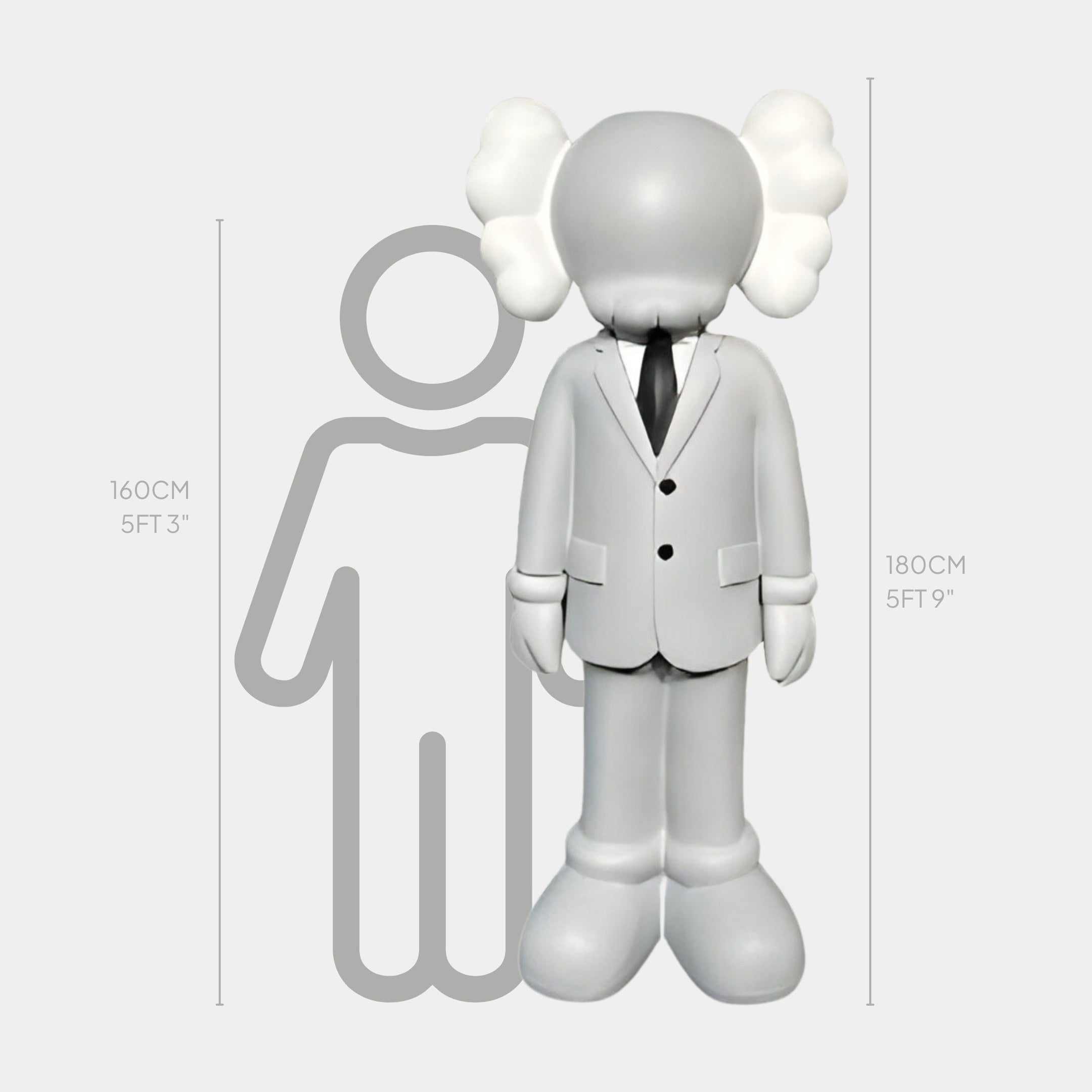 The Giant Sculptures Soft Grey Suit Iconify Director Sculpture features a cartoon-like figure in a white suit and black tie, embodying Modern Pop Art. Standing at 180 cm, it towers over a 160 cm outlined figure with height comparisons given in both centimeters and feet/inches.