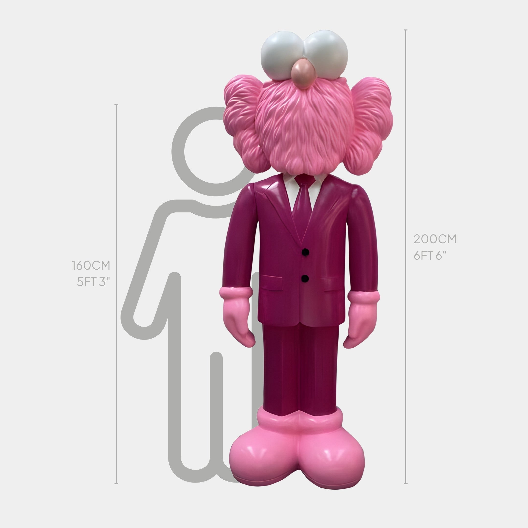 The Deep Magenta Suit Iconify CEO Sculpture by Giant Sculptures features a pink character statue with exaggerated features, large eyes, round nose, and textured hair. Standing 200 cm tall against a human outline of 160 cm, it exudes modern sophistication in its deep magenta suit.