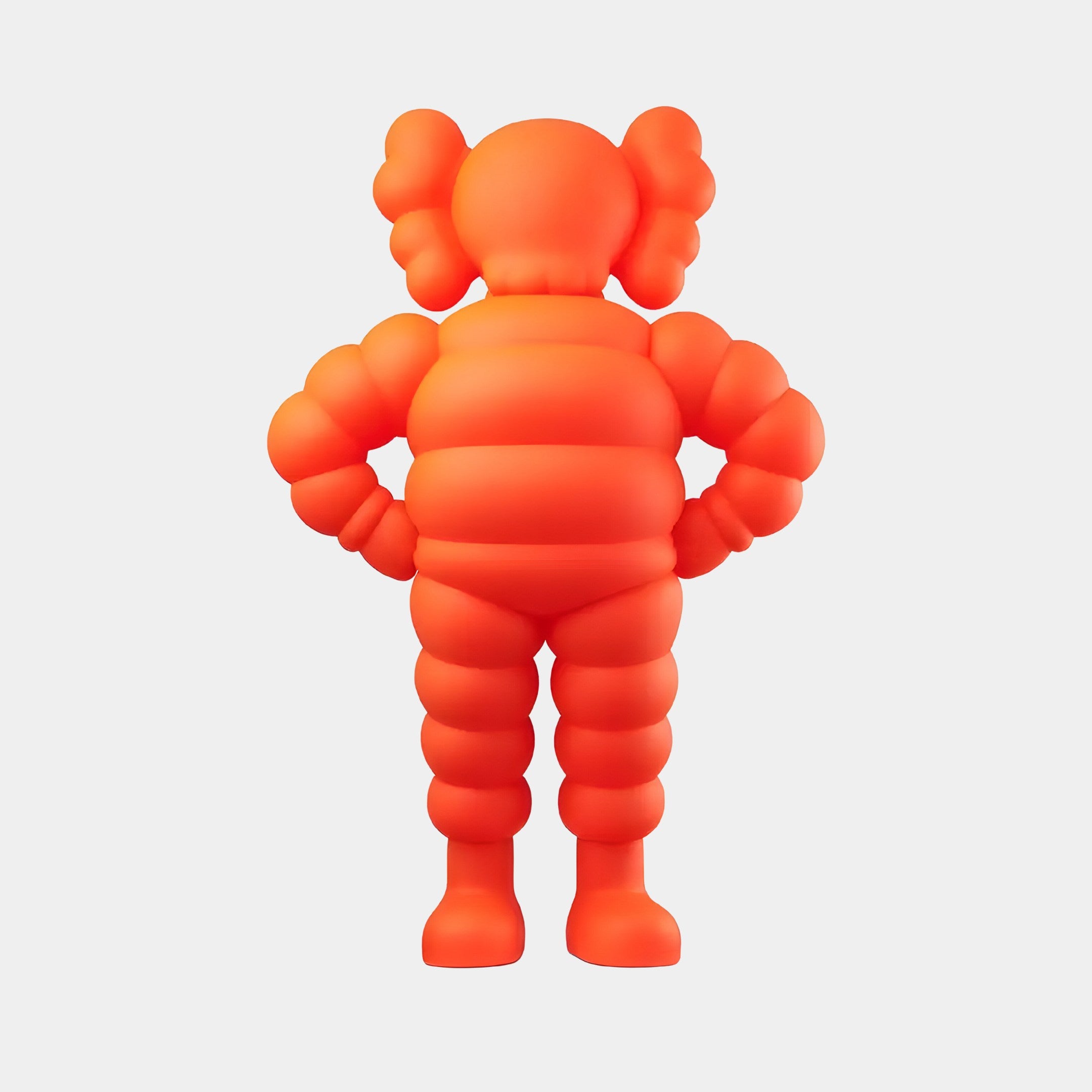 The Fiery Orange Iconify Rollo Warrior Sculpture by Giant Sculptures boasts a modern design with a segmented body and large round ears, standing 80cm tall. Its smooth, glossy finish and hands-on-hips pose contribute to its playful charm.