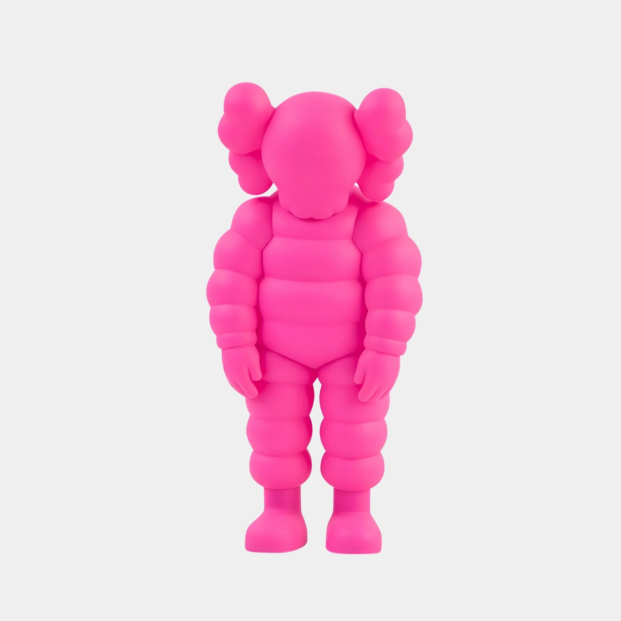 The Electric Pink Iconify Rollo Sculpture by Giant Sculptures is an 80cm contemporary masterpiece, showcasing a bright pink figure with bulbous limbs and rounded ears. It embodies modern arts simplicity with a featureless face against a plain white backdrop.