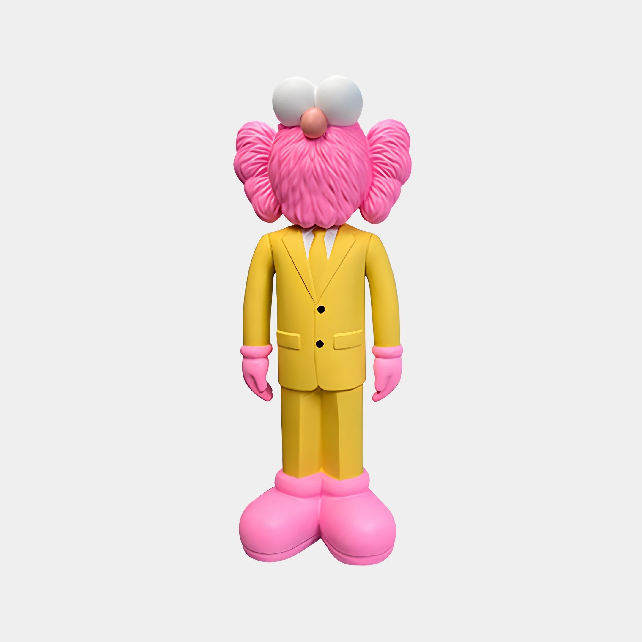 The Sunbeam Yellow Suit Iconify CEO Sculpture by Giant Sculptures is a 90cm colorful, cartoon-style figure with a pink fuzzy head, large round white eyes, oversized pink shoes and gloves. This piece blends pop culture art and contemporary design.