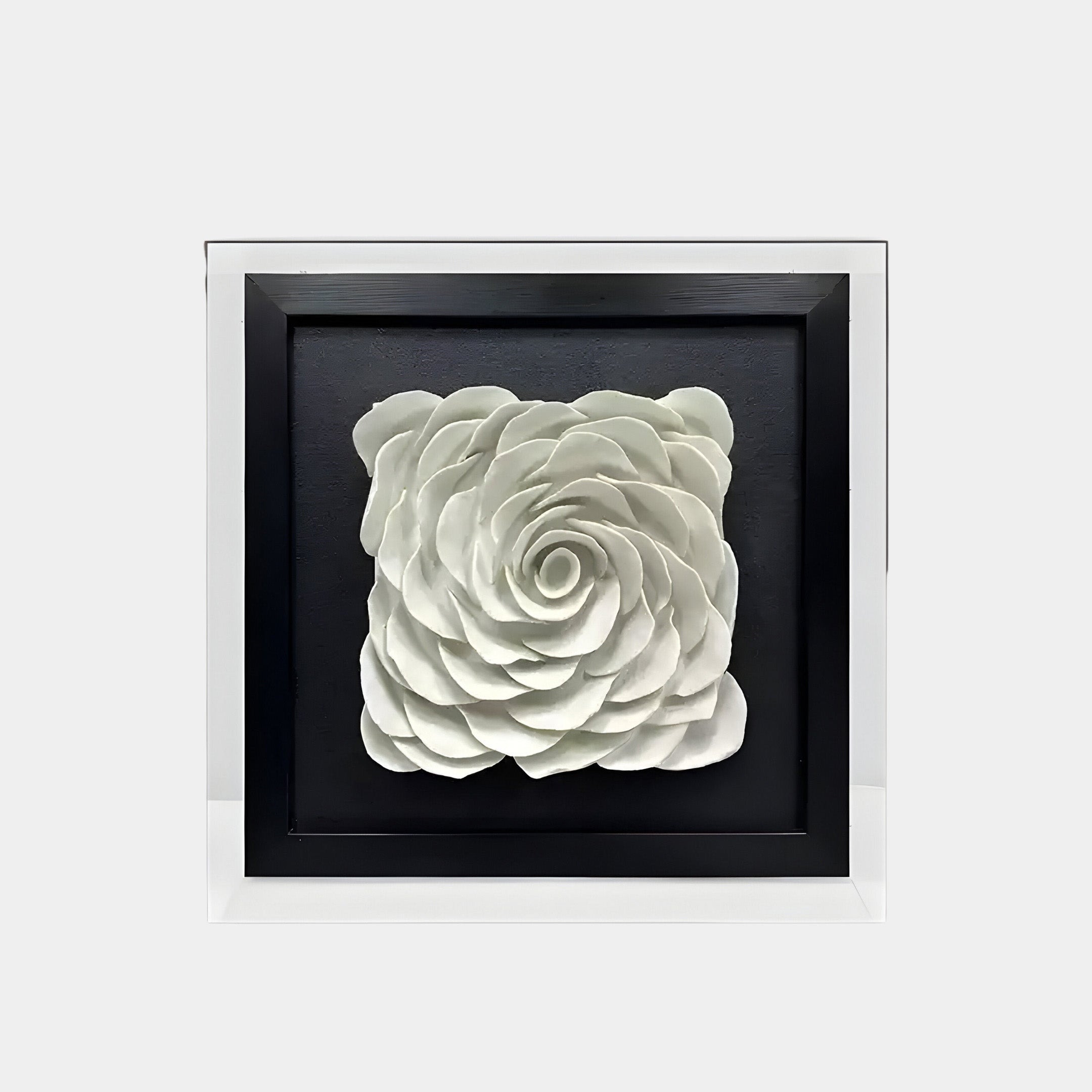 A framed ceramic wall art piece featuring a large, intricately sculpted white rose in full bloom. The petals are carefully layered, creating a realistic, three-dimensional texture.