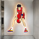 The Enlustra IV Game On UV Wood LED Wall Art by Giant Sculptures features an anime basketball player in a red jersey with a basketball against a white wall, perfectly complementing modern, minimalistic interiors with its vibrant design.