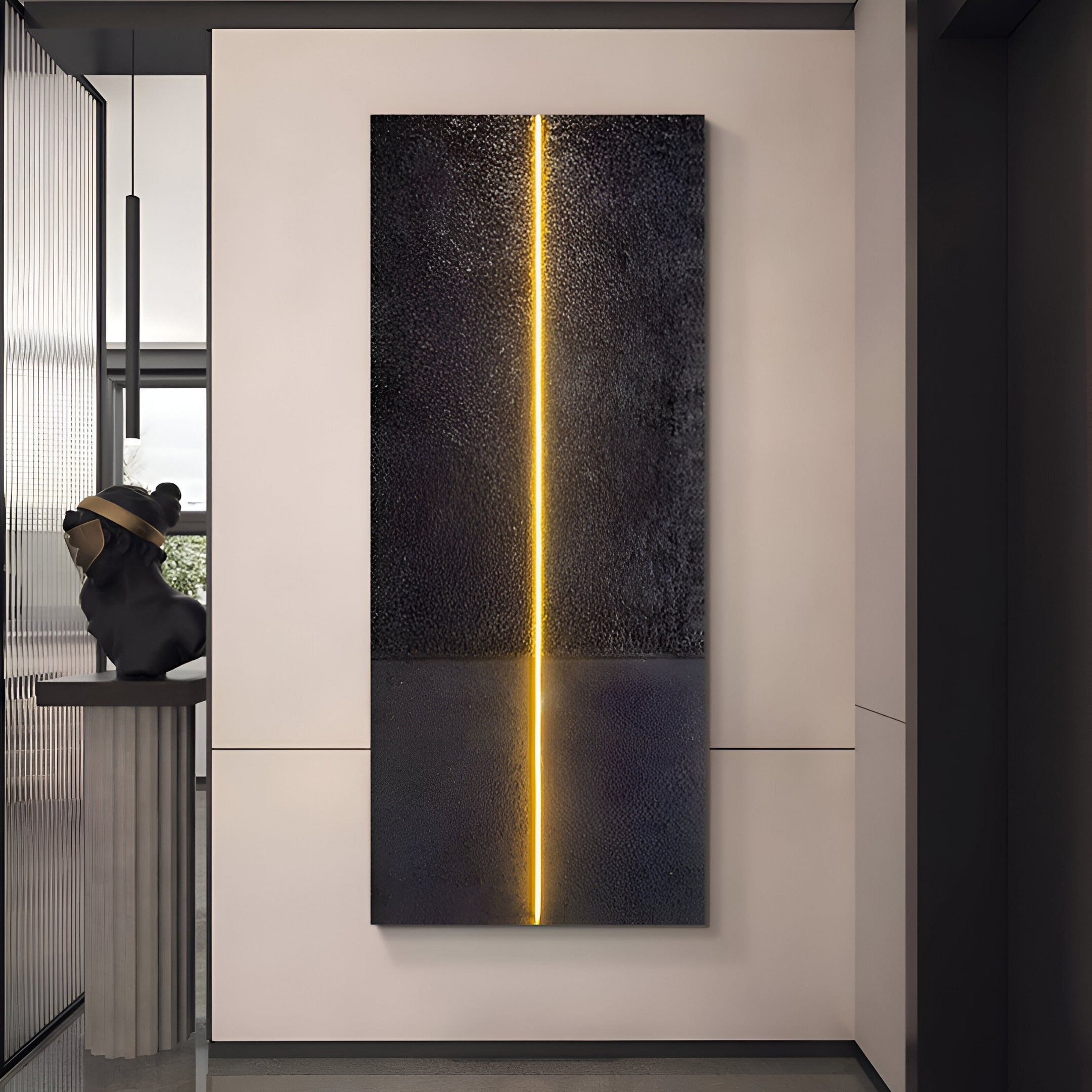 A modern interior features the Eternia Midnight Textured Oil Painting LED Wall Art by Giant Sculptures, with a glowing yellow line on the black surface enhanced by subtle LED highlights. Nearby, an elegant sculpture of a seated figure on a pedestal adds depth to the space.