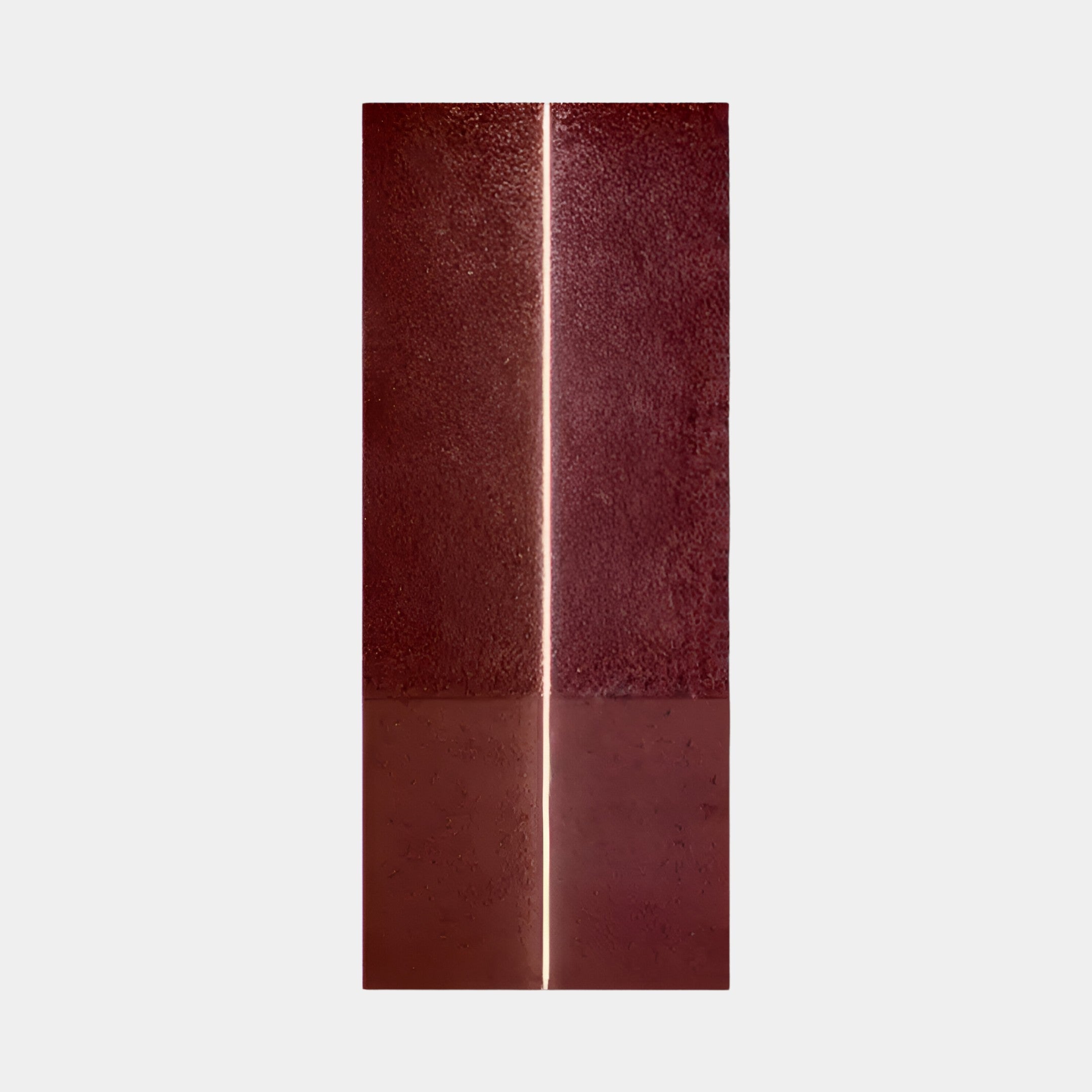 The Eternia Crimson Textured Oil Painting LED Wall Art by Giant Sculptures is a tall, vertical piece with a central narrow line dividing it. It features rough yet detailed textures and a reflective base mirroring its vibrant hues.