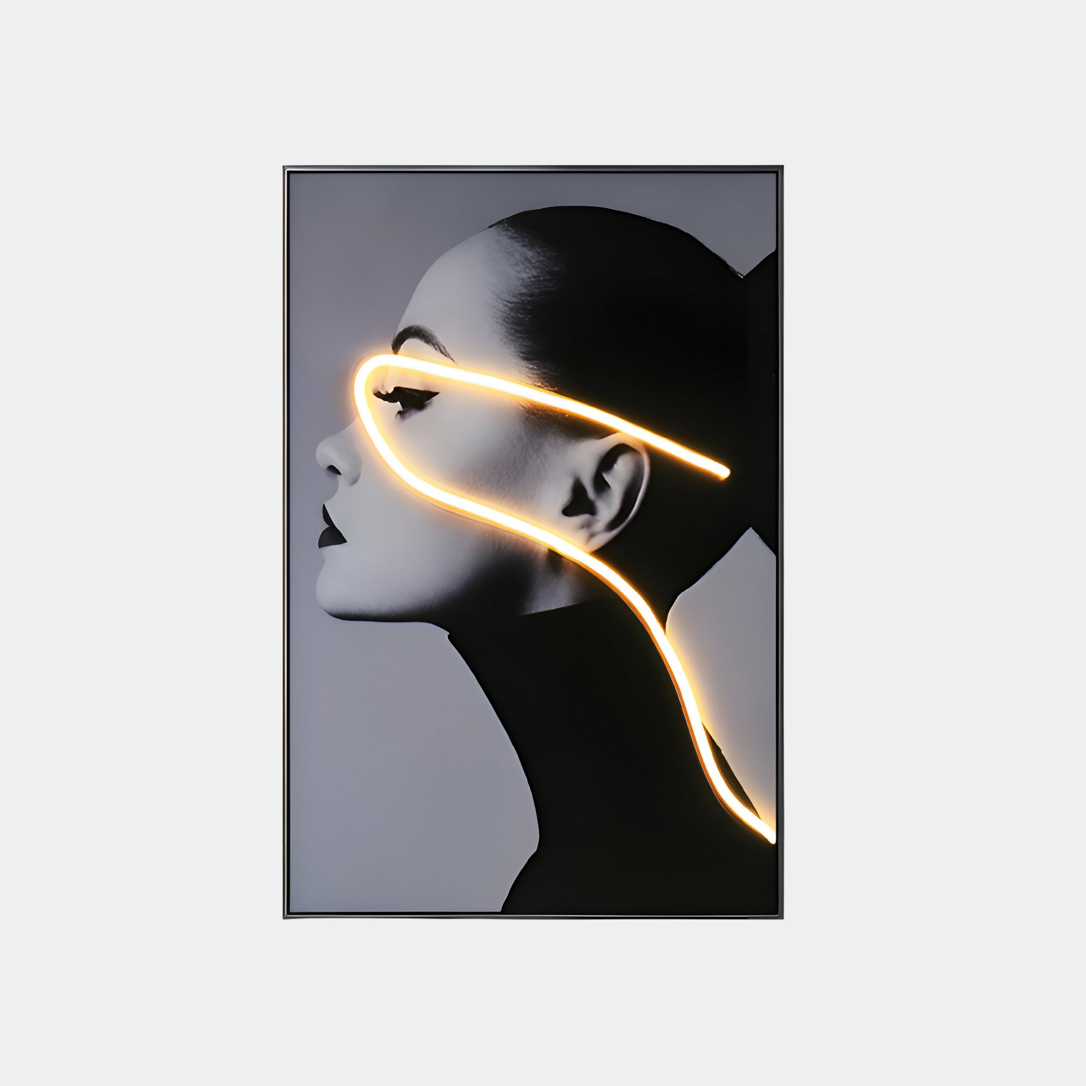 A profile of a woman with sleek, pulled-back hair exudes modern elegance as a glowing neon line traces from her forehead to neck. This evokes the Sylva Radiant Grace Canvas 3D LED Wall Art by Giant Sculptures, set against a grayscale background for an artistic effect.