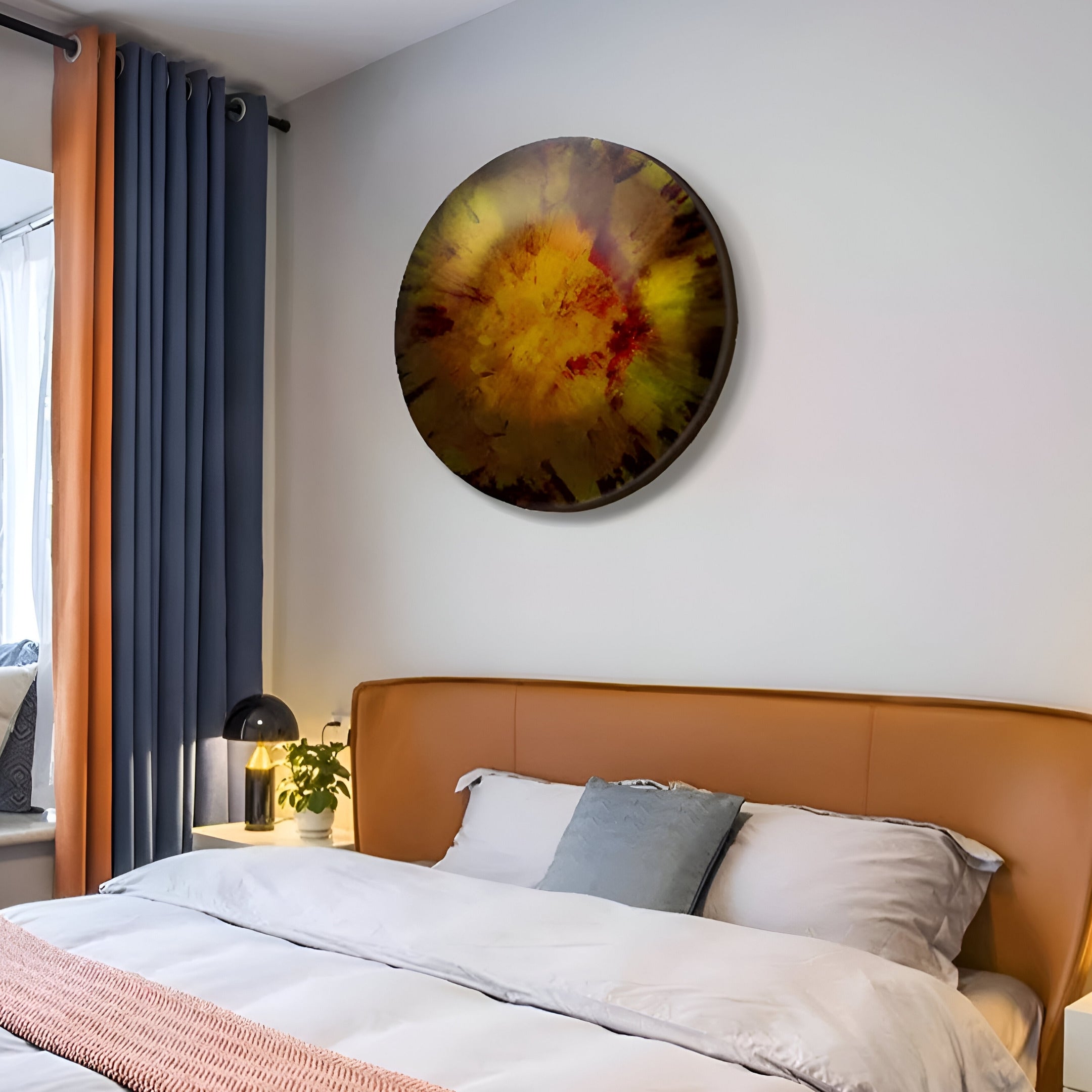 A bedroom with a brown headboard and white bedding features the Genesis Sunburst 3D Resin Crystal Porcelain LED Wall Art by Giant Sculptures. A lamp on the nightstand complements dark curtains, enhancing the modern aesthetic of this tranquil space.