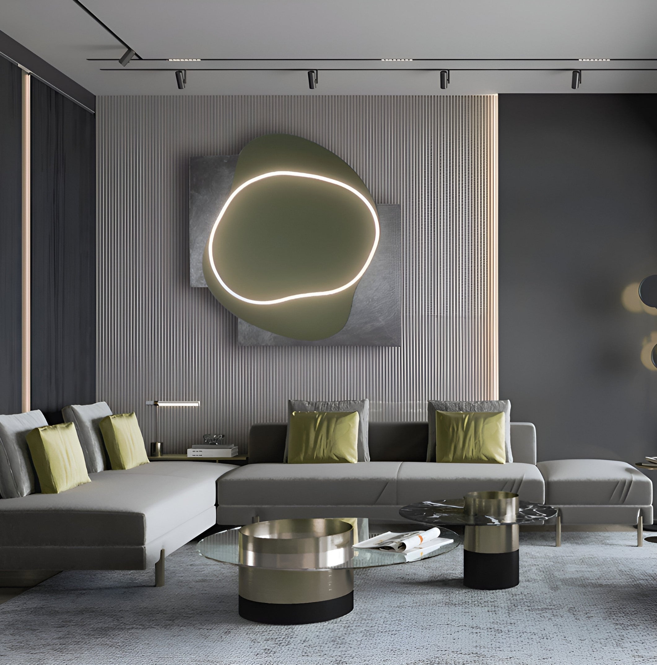 A modern living room showcases a gray sectional with green and gray pillows, paired with a round glass coffee table. The calming ambiance is enhanced by Giant Sculptures Gleam Olive Serenity 3D Leather LED Wall Art, featuring abstract circular designs on a textured gray wall.