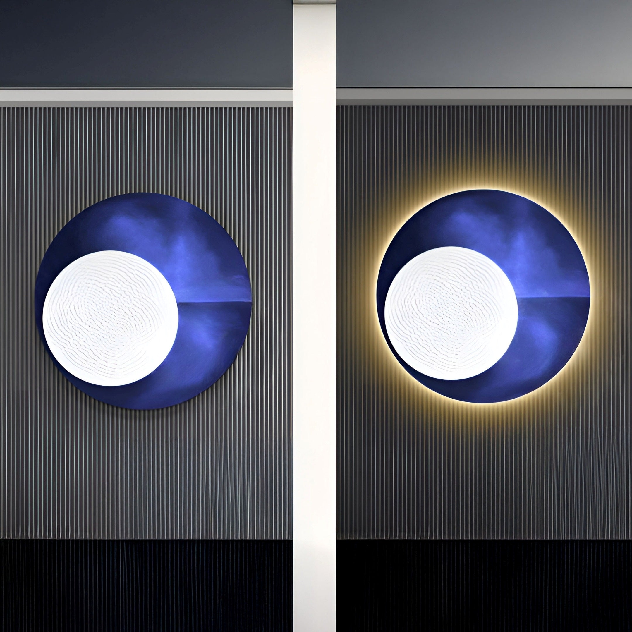 The Flaria Twilight 3D LED Wall Art by Giant Sculptures displays two circular sculptures with glowing edges on a dark striped wall. Each includes a large white center and a dark blue ring, with one featuring a subtle halo effect, embodying modern LED wall art.